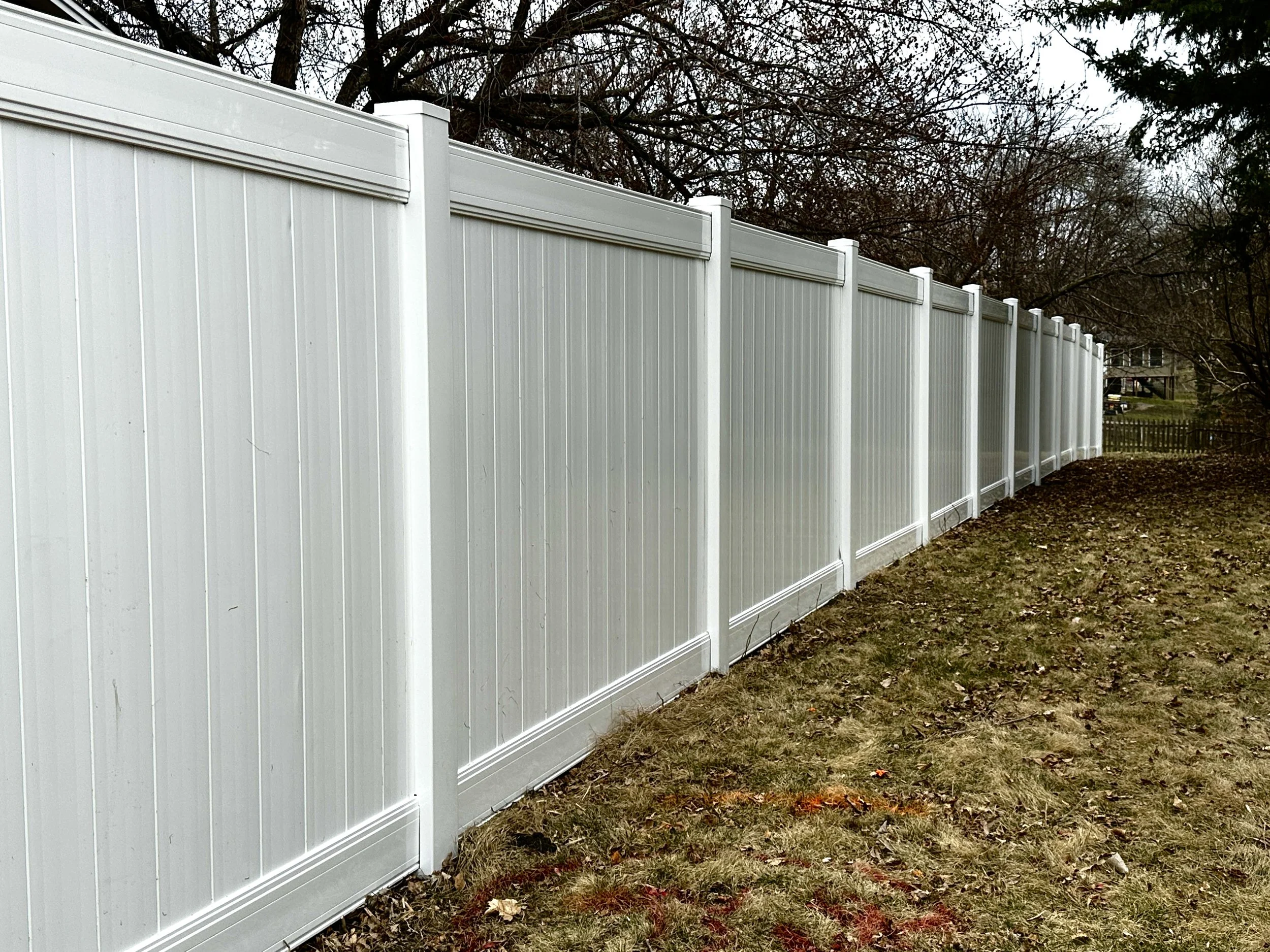A White Vinyl Privacy Fence built in Brooklyn Park, MN. Built with Lifetime Warranty Steel Posts.