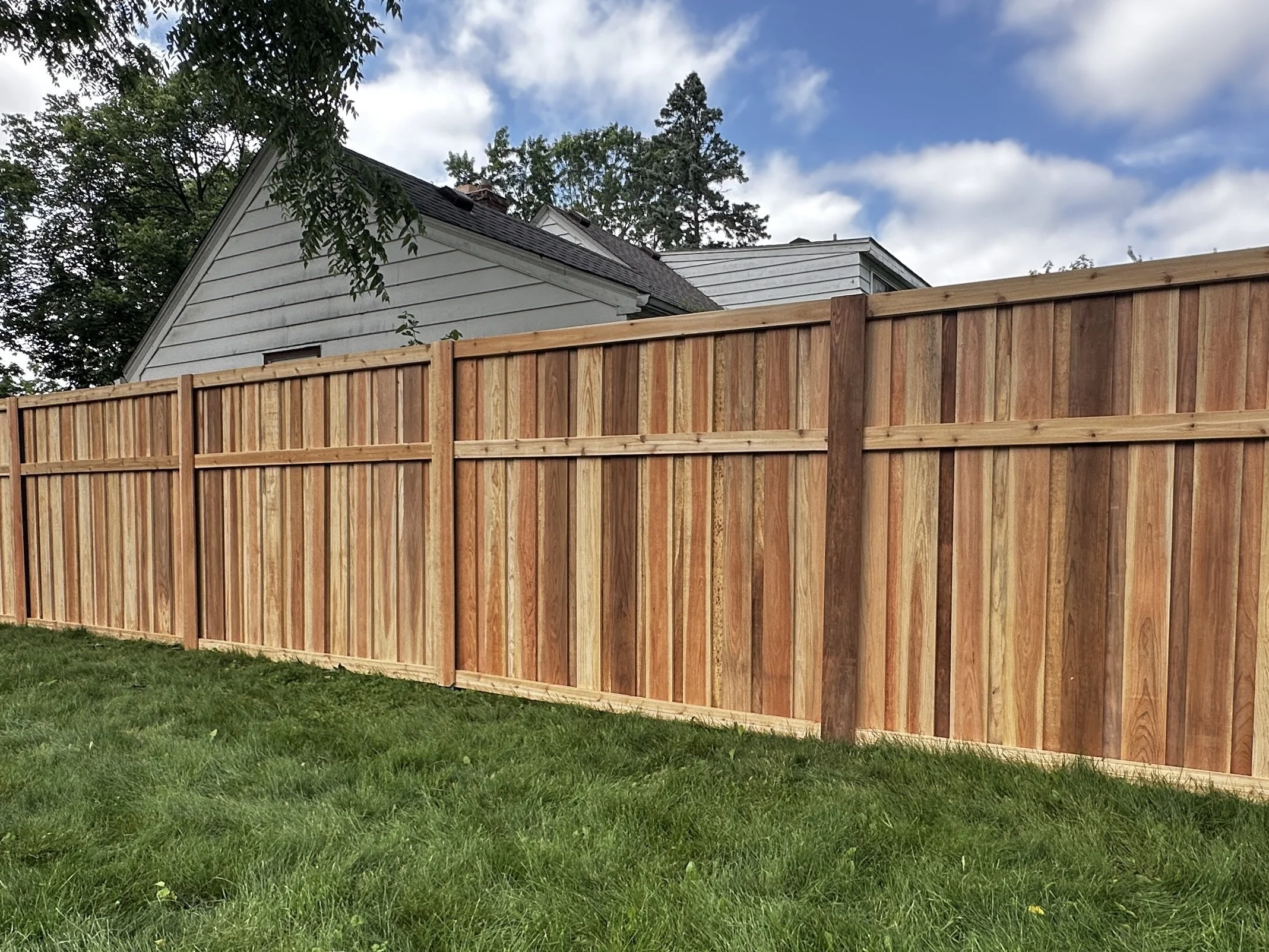 A Cedar Board & Batten Privacy Fence in Crystal, MN. Built with Lifetime Warranty Steel Posts and Kiln-Dried Clear Cedar. Assembled entirely with Screws.