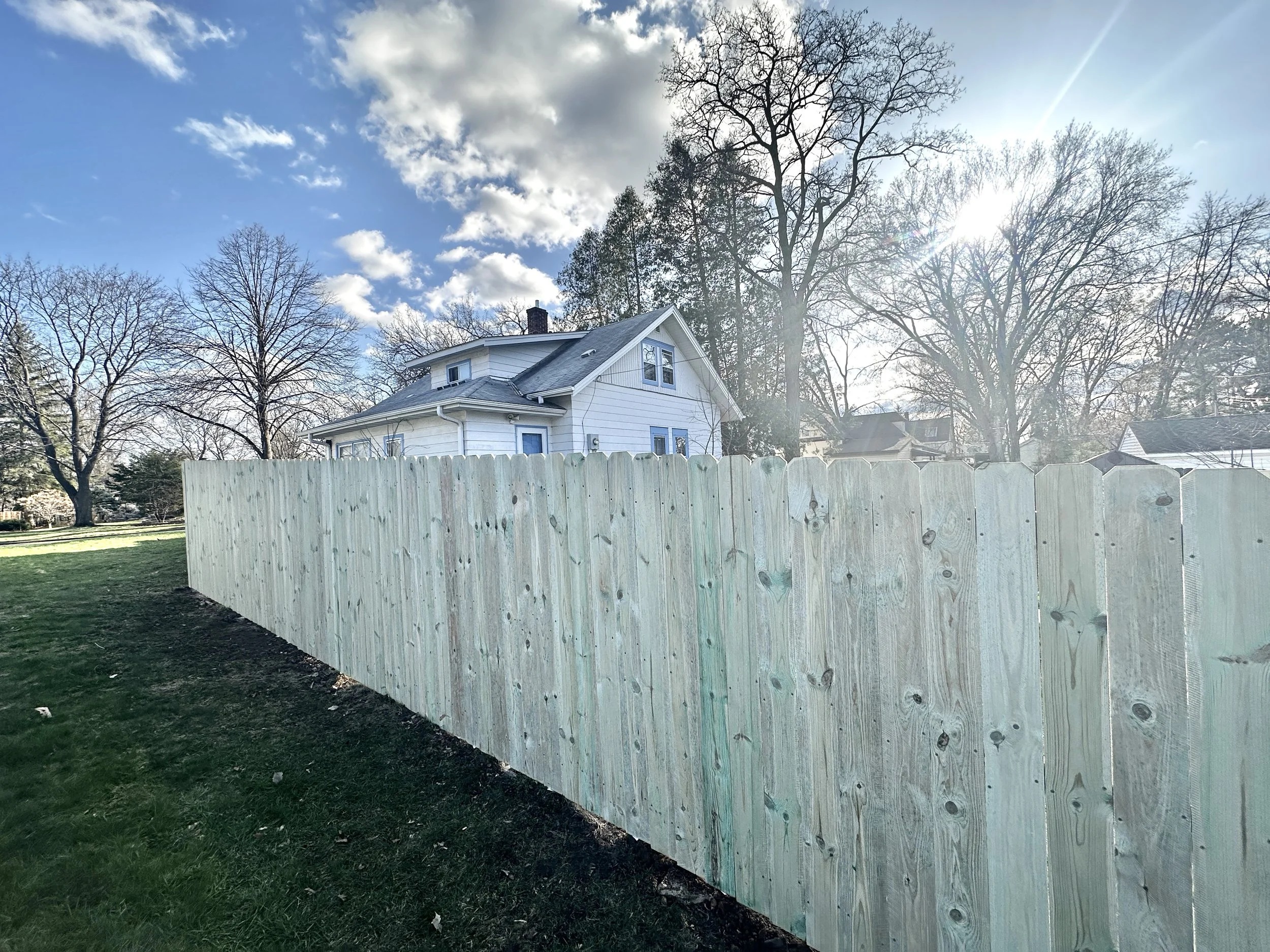 A Treated Pine Vertical Privacy Fence in St. Paul, MN. Built with Lifetime Warranty Steel Posts and Treated Pine. Assembled entirely with Screws.
