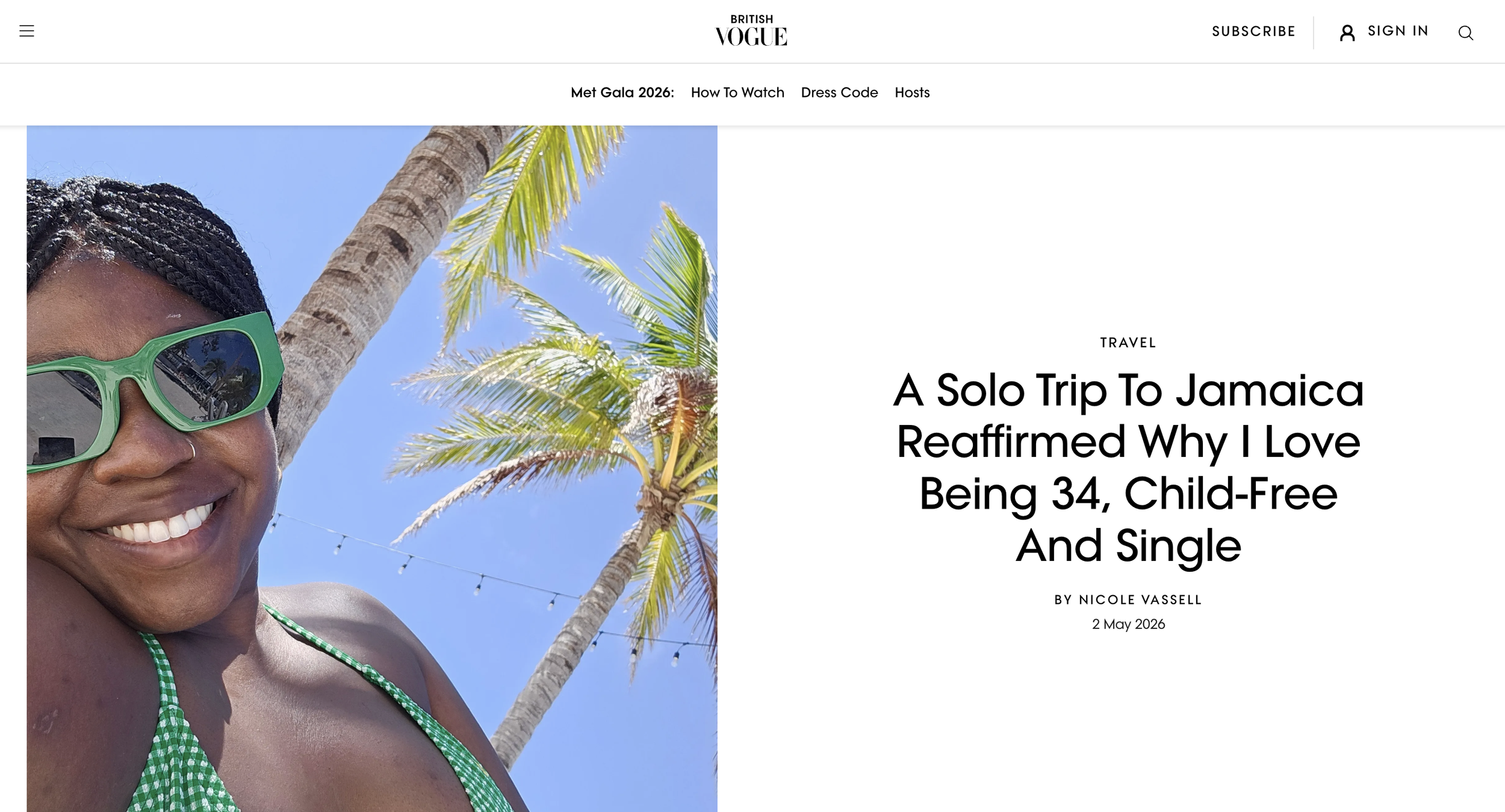 Nicole smiles beneath a palm tree in Jamaica