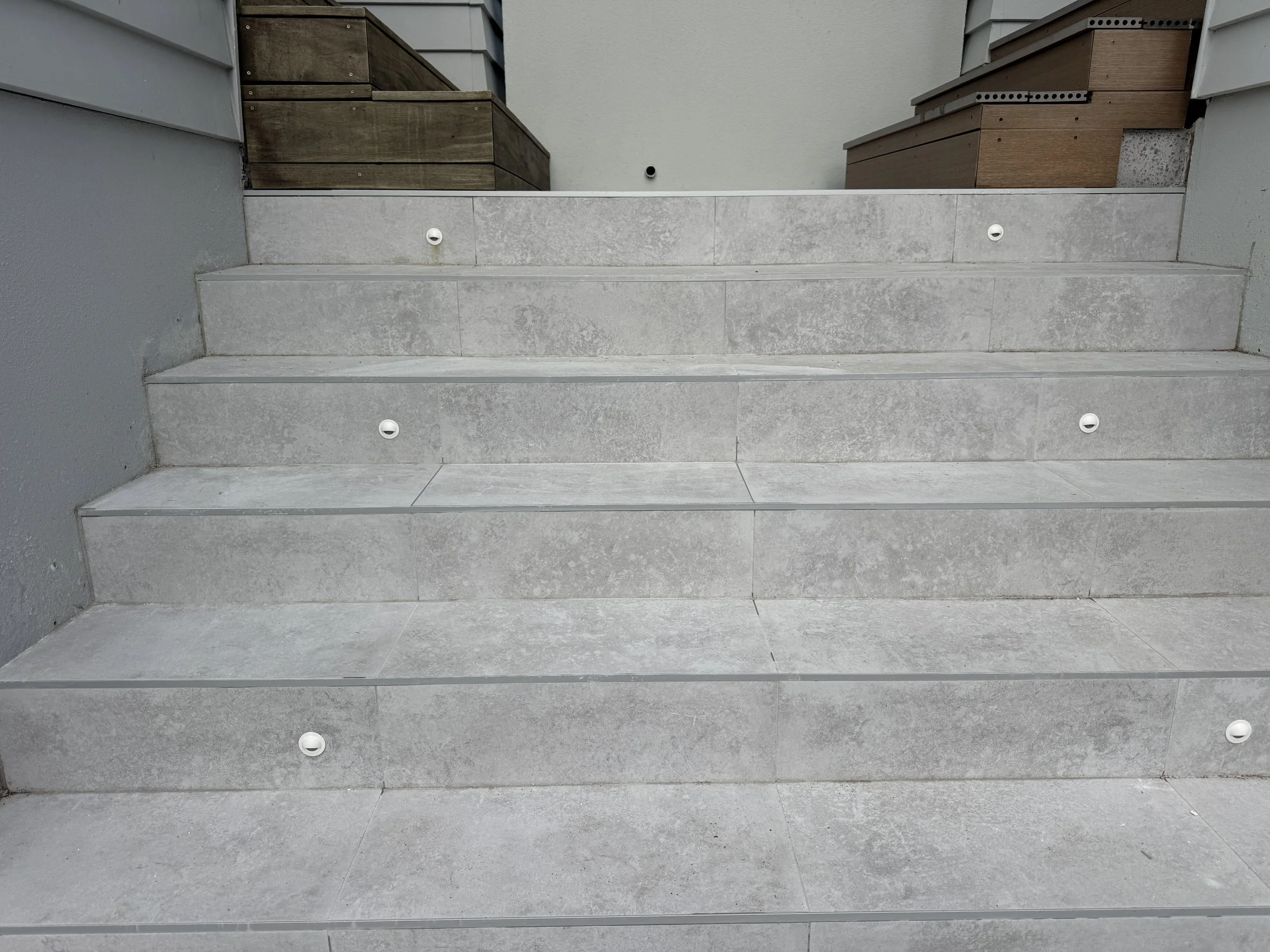 Outdoor tiling with 600x600 anti slip. Job in Milford Auckland. Done in 2026