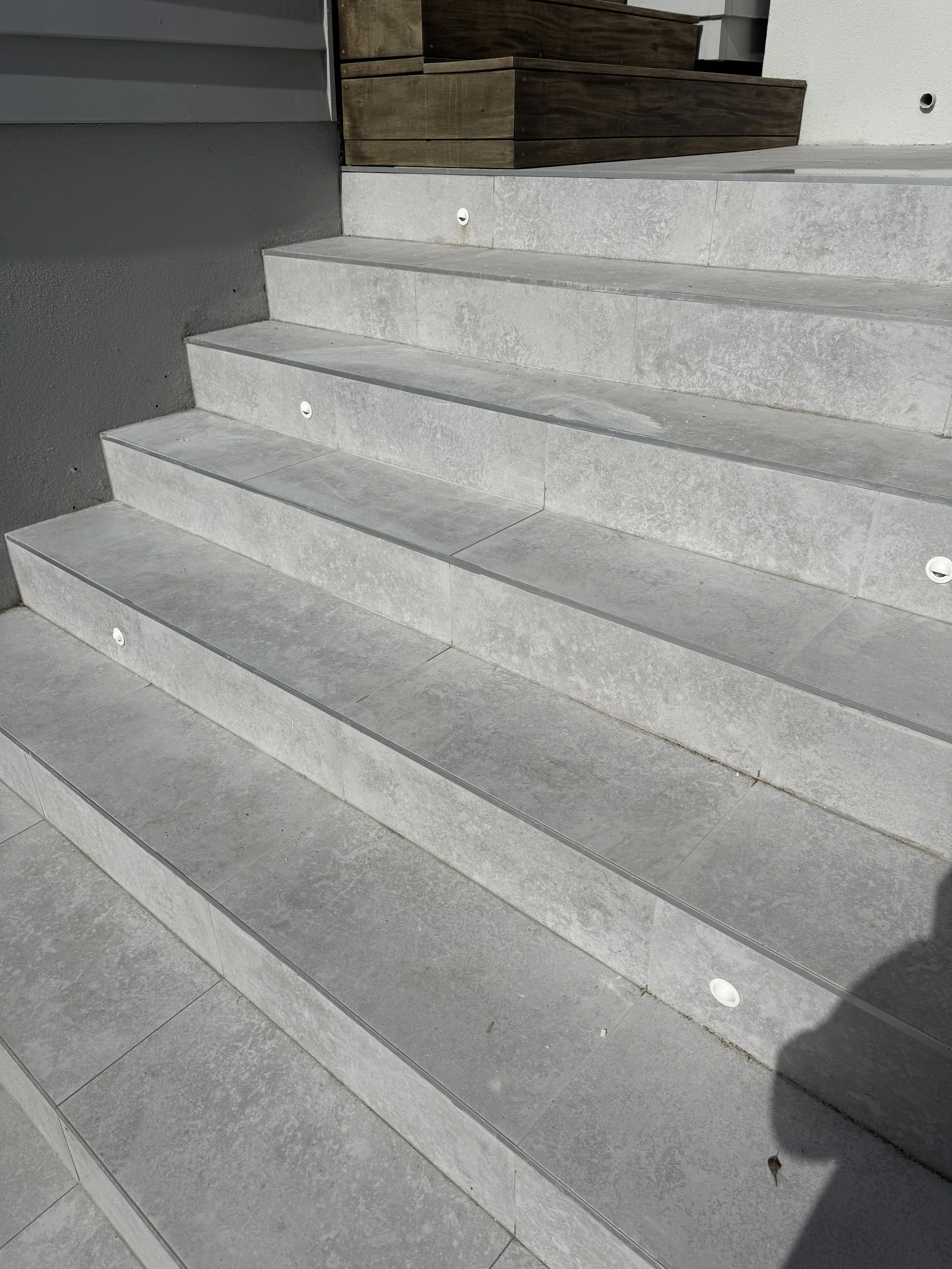 Outdoor tiling with 600x600 anti slip. Job in Milford Auckland. Done in 2026