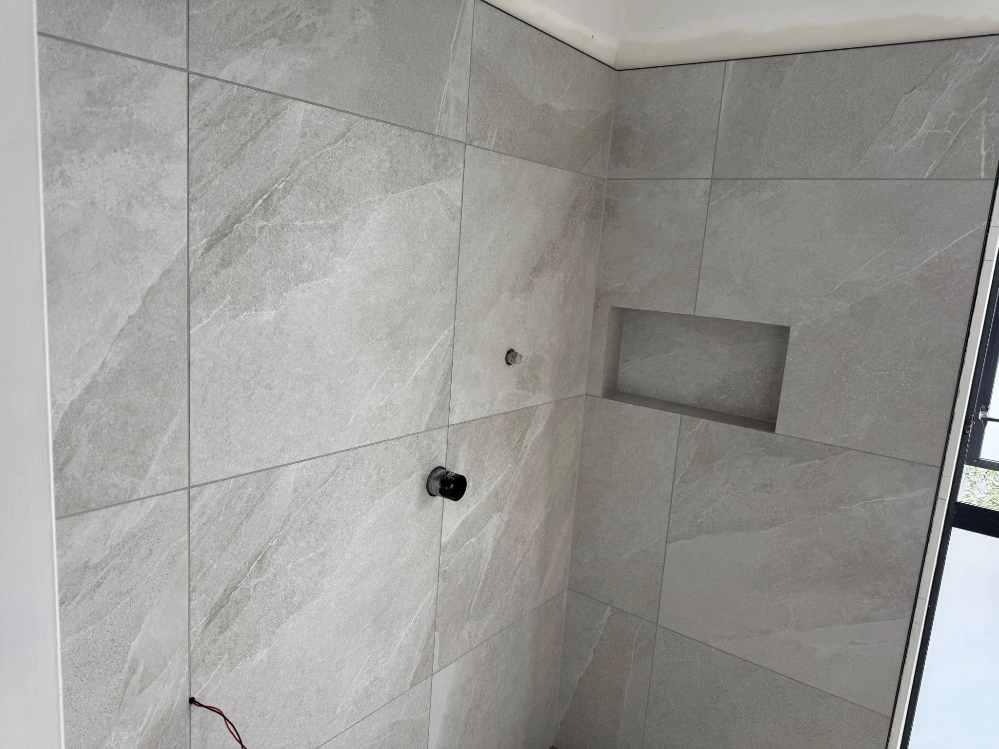 How much does bathroom tiling cost in Auckland in 2026?