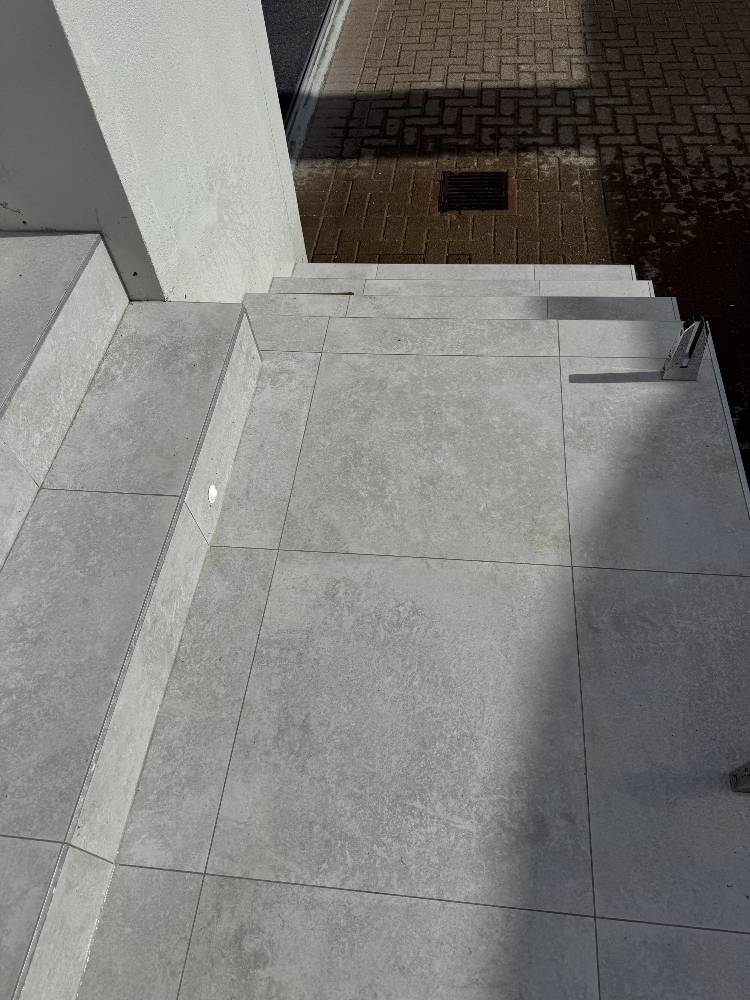 Outdoor tiling with 600x600 anti slip. Job in Milford Auckland. Done in 2026