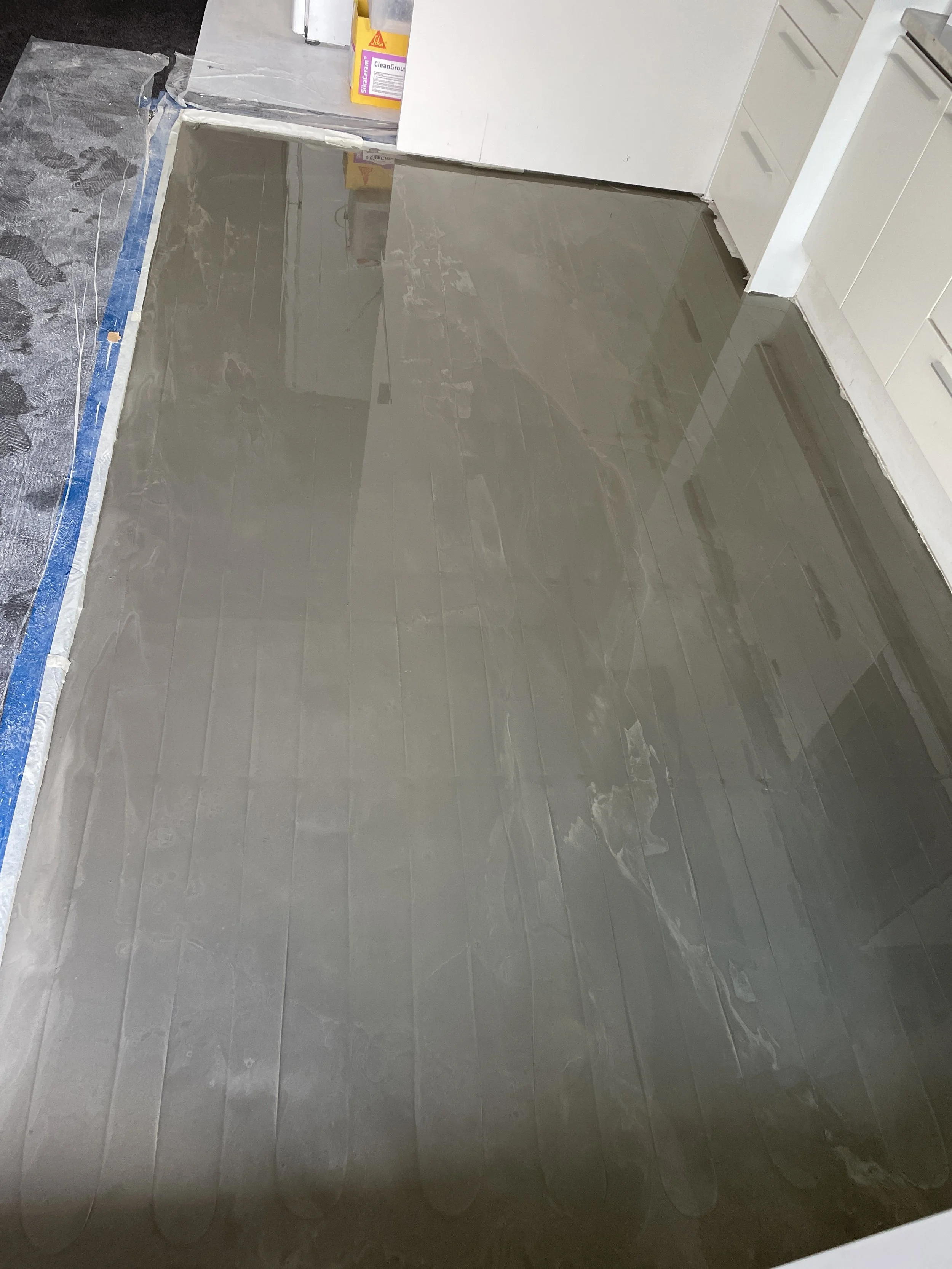 Levelling compound over underfloor heating cable. Job in Grey Lynn in 2023