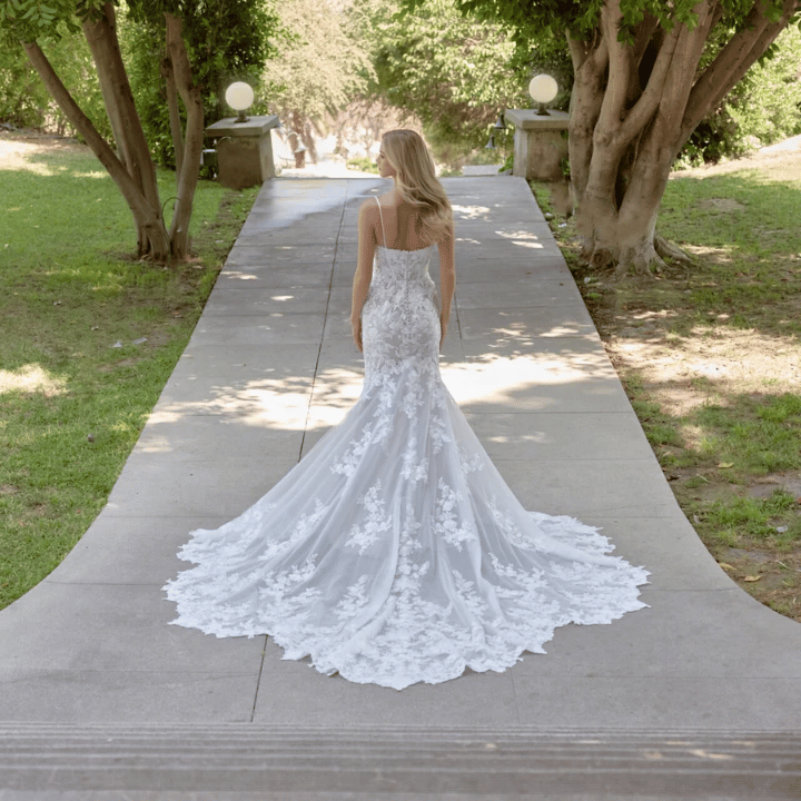 View of bride wearing Essense of Australia wedding dress outdoors