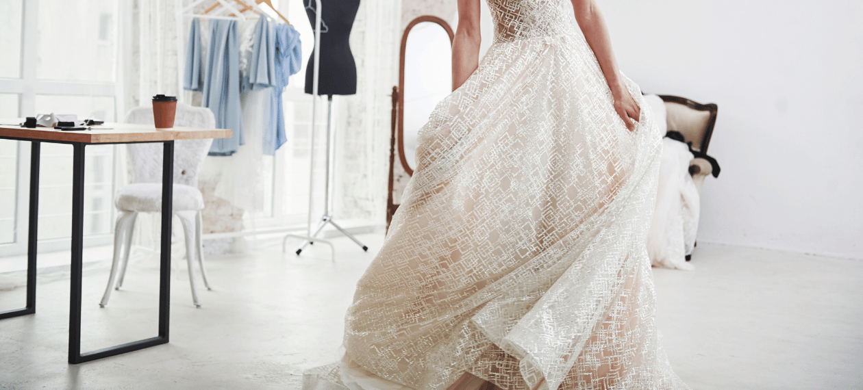 Bride trying on a lace wedding dress during a bridal appointment