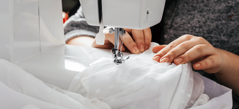 wedding dress alterations with seamstress sewing bridal gown fabric