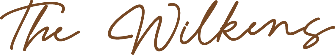 Stylized text reading "The Wilkens" in cursive brown font.