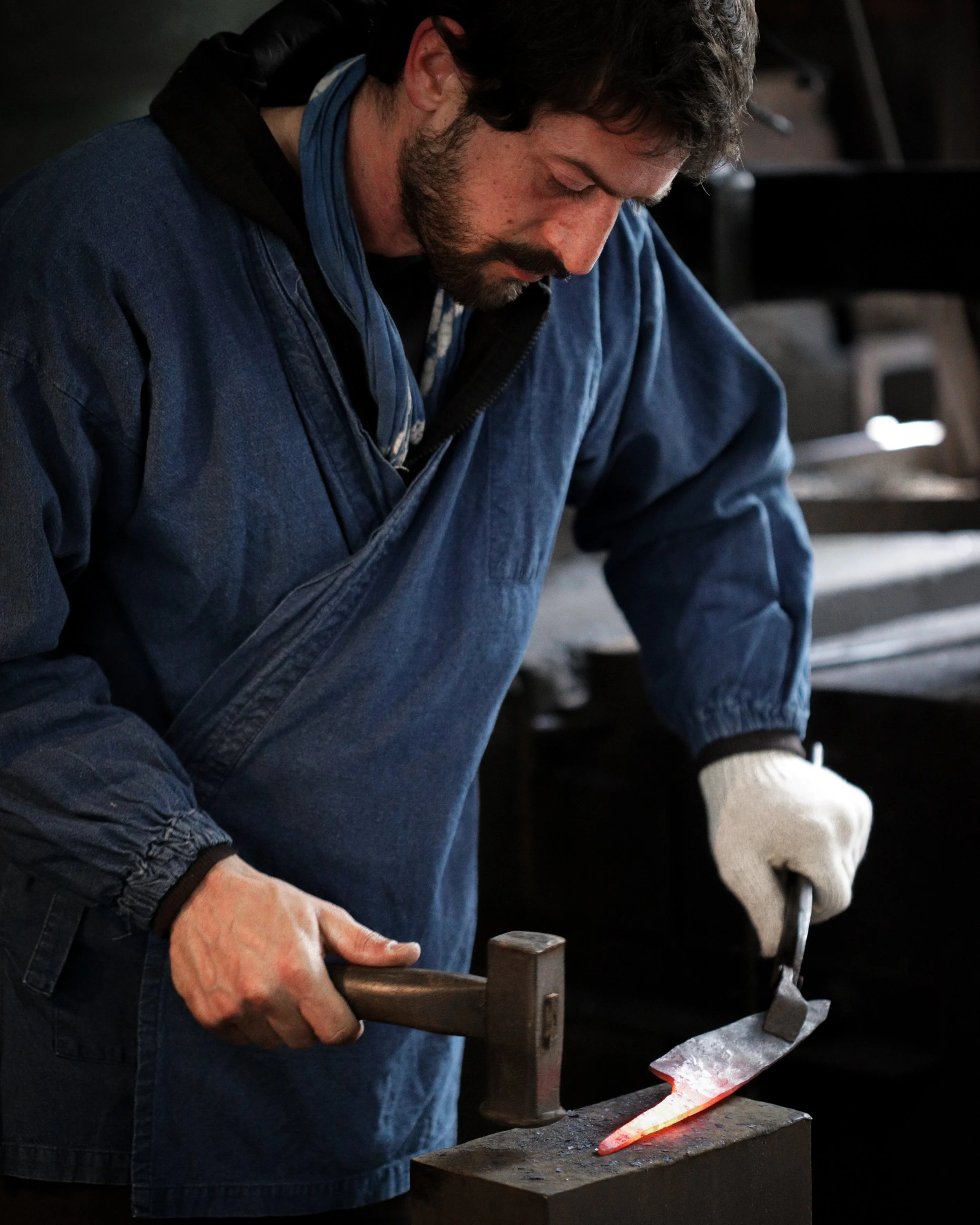 Ido Ferber forging a Japanese kitchen knife in Knife Making Class Japan