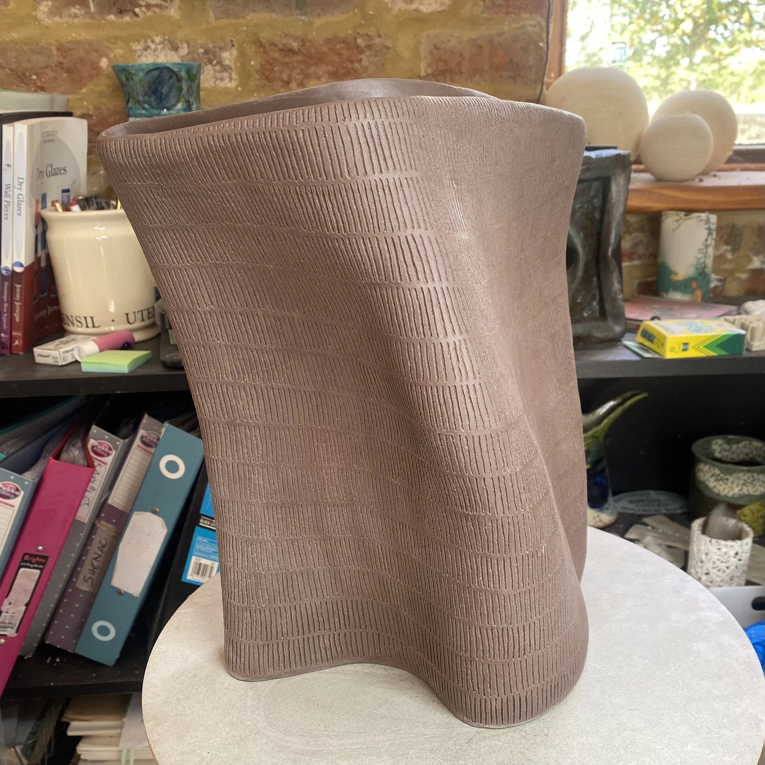 unfired 'Held by Place' vessel 2/5