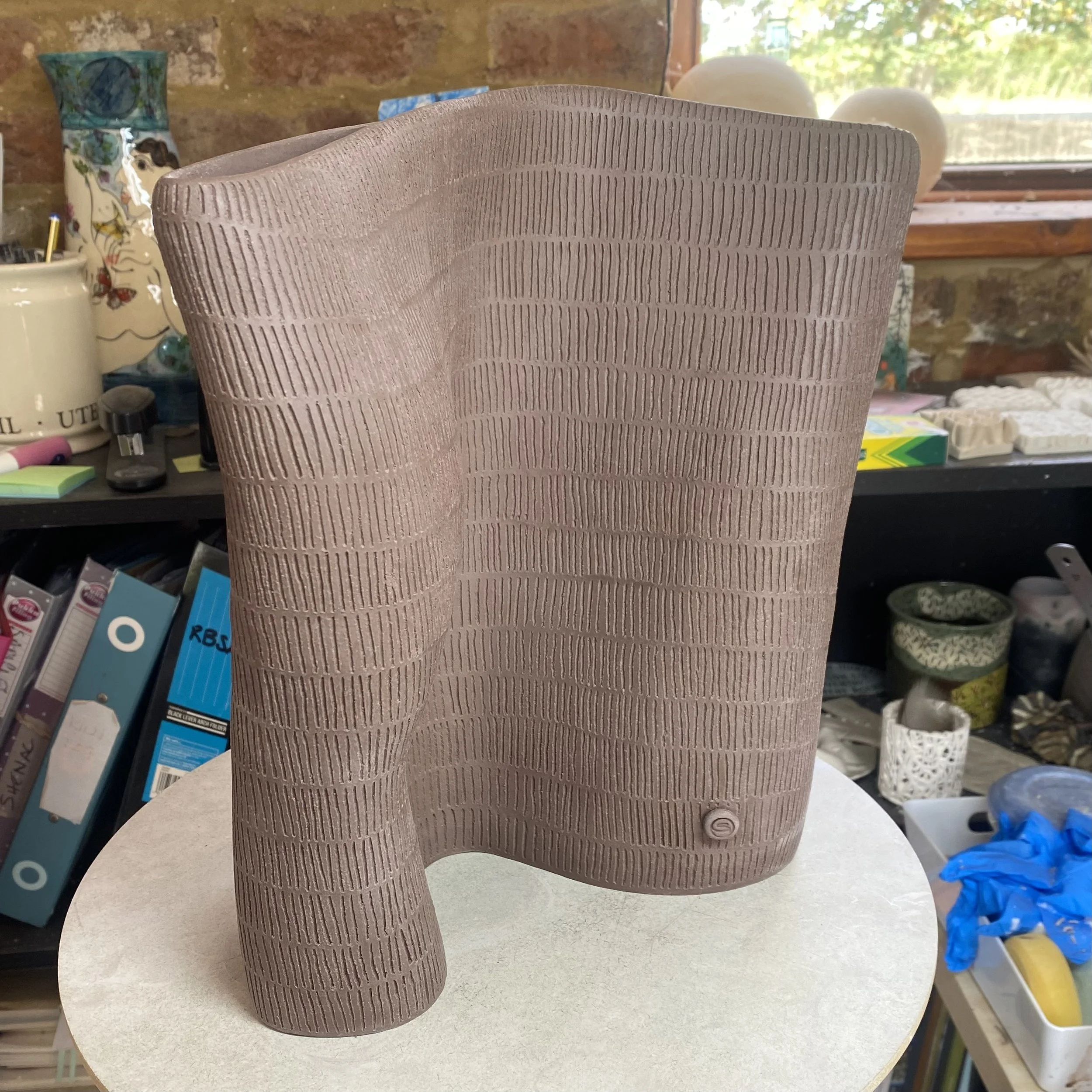 unfired 'Held by Place' vessel 2/5