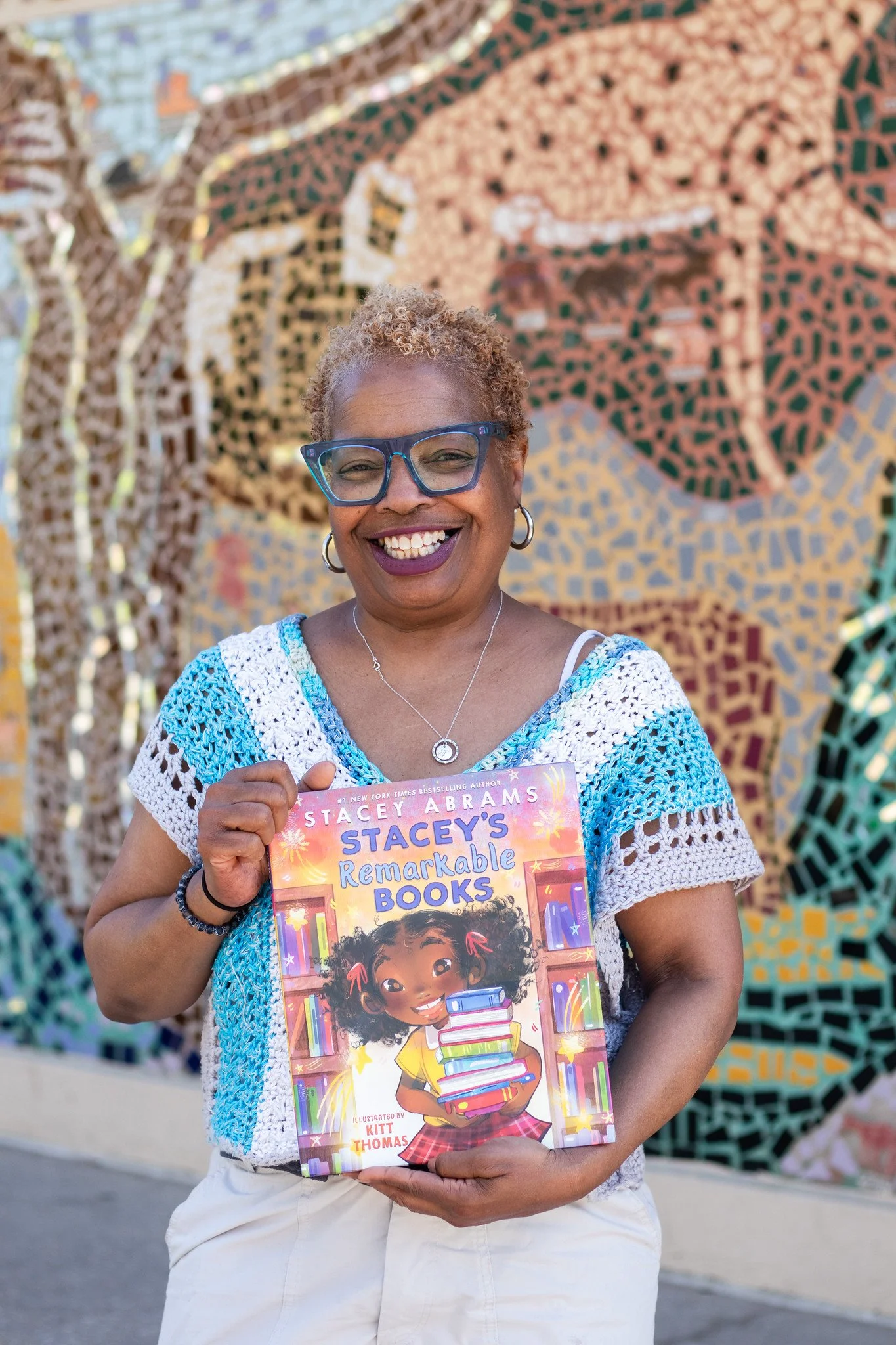 Toya “Gigi” Algarin holds up Stacey’s Remarkable Books, a story she shares with her students.