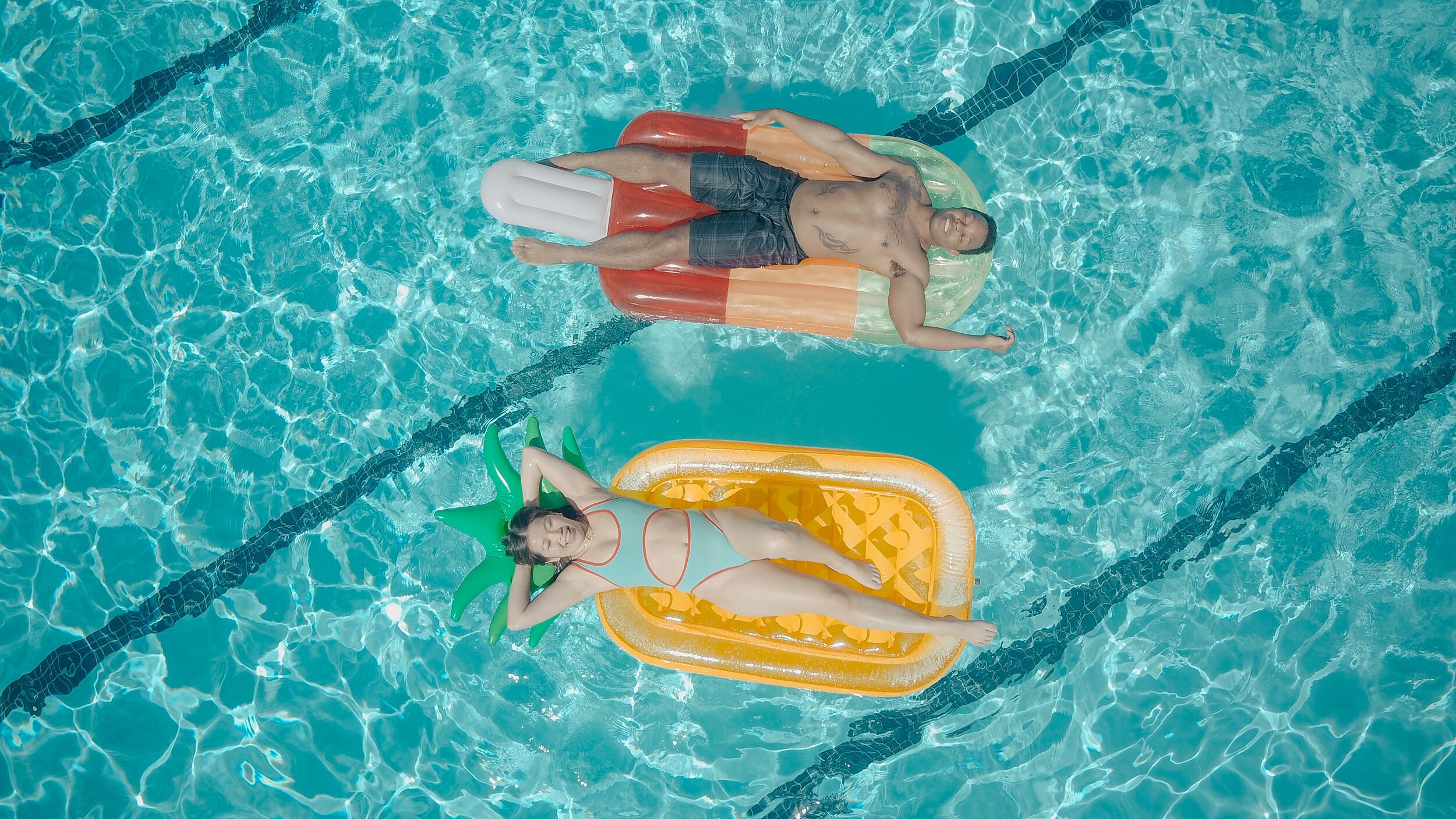 Swimmers floating in a pool