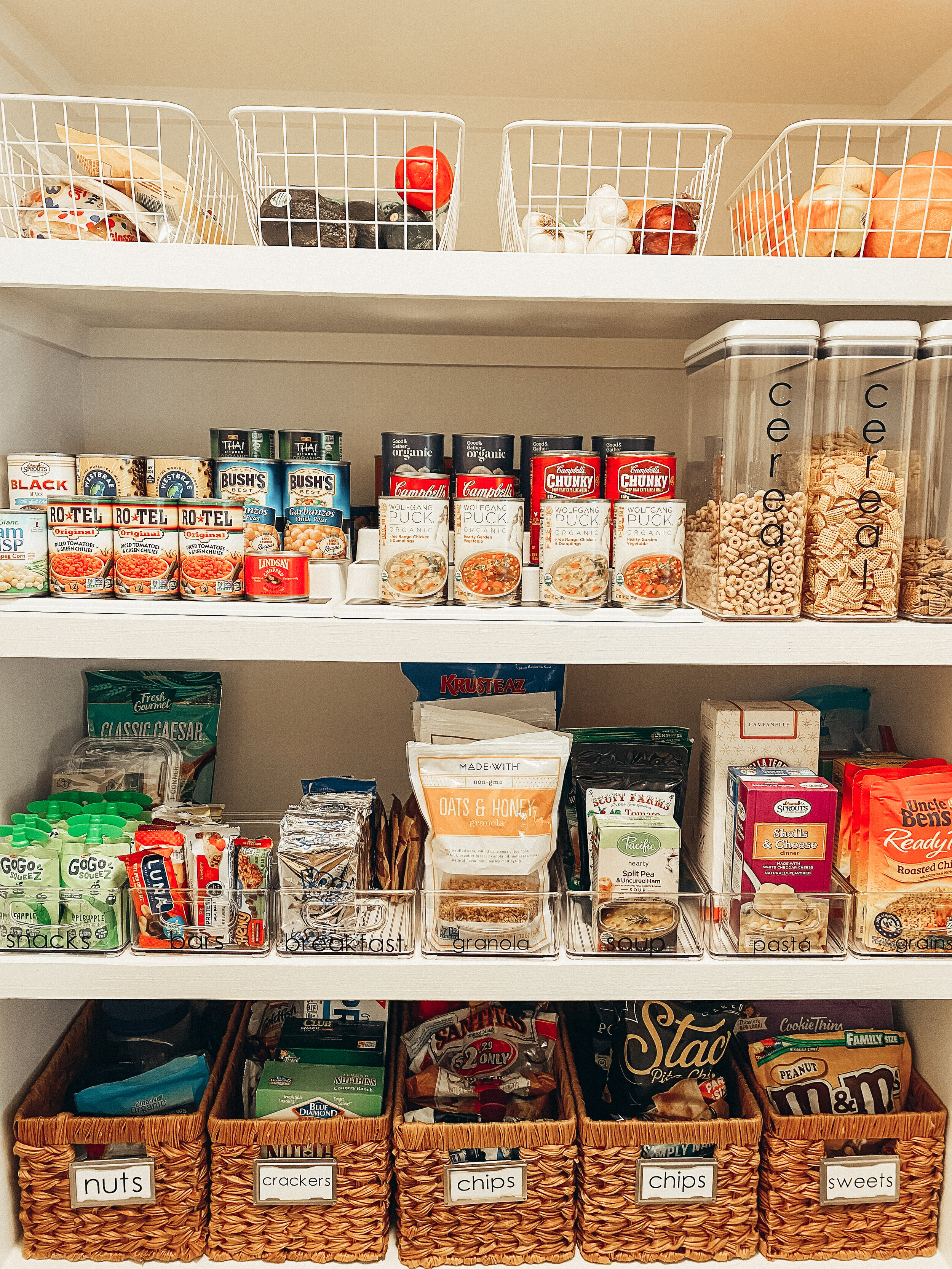 Pantry organized with cans and food in clear plastic containers