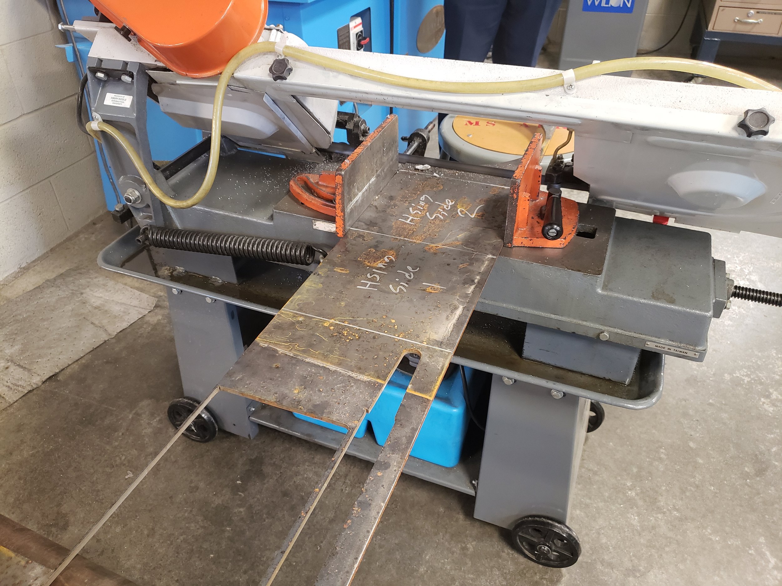 Using the band saw to cut crusher housing walls.