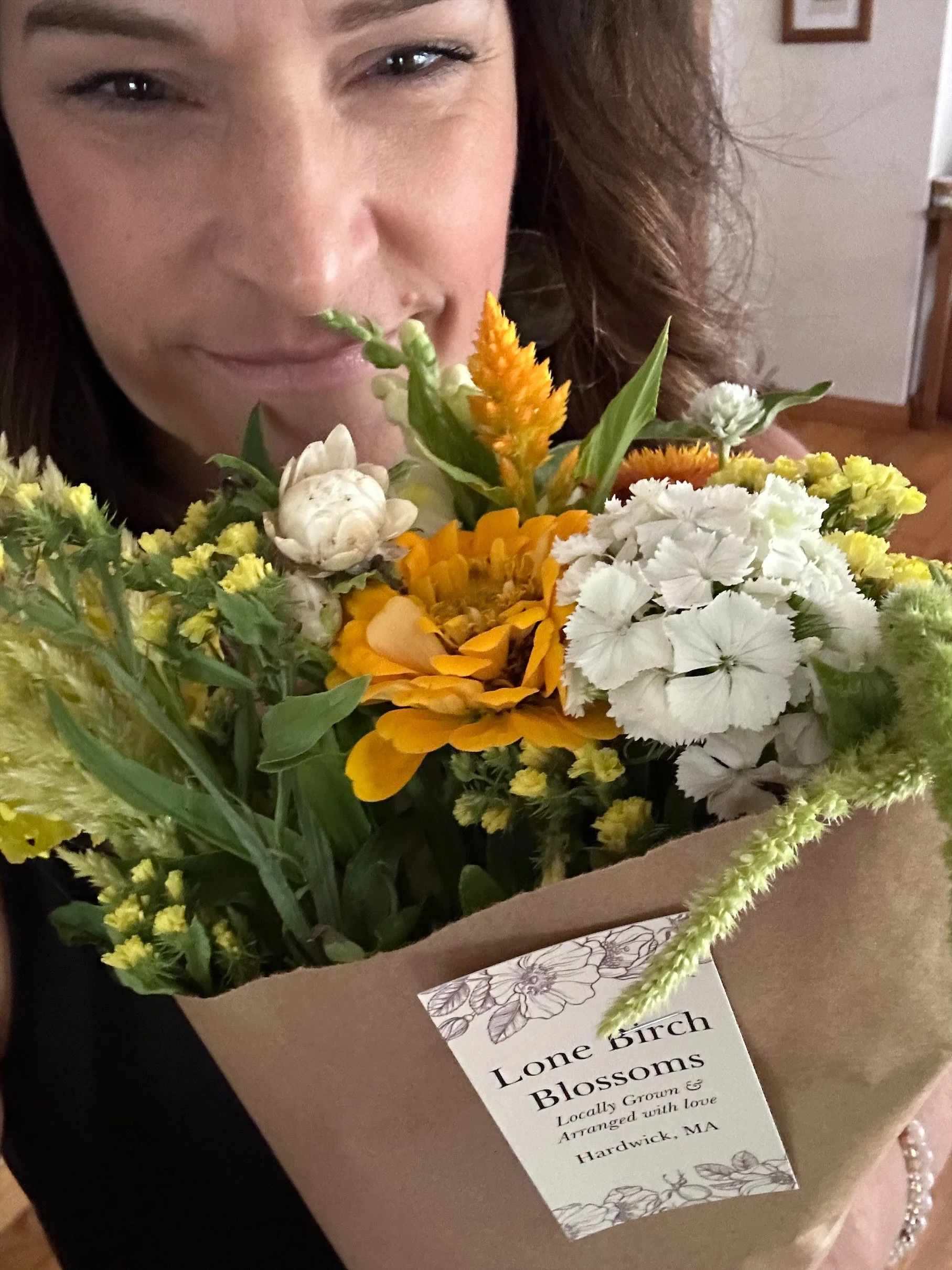 holding flowers .jpeg