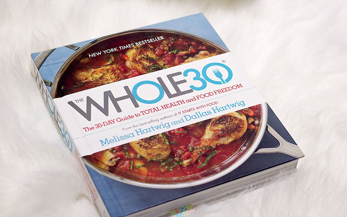 A picture of the whole 30 book which is the outline for completing a whole 90.