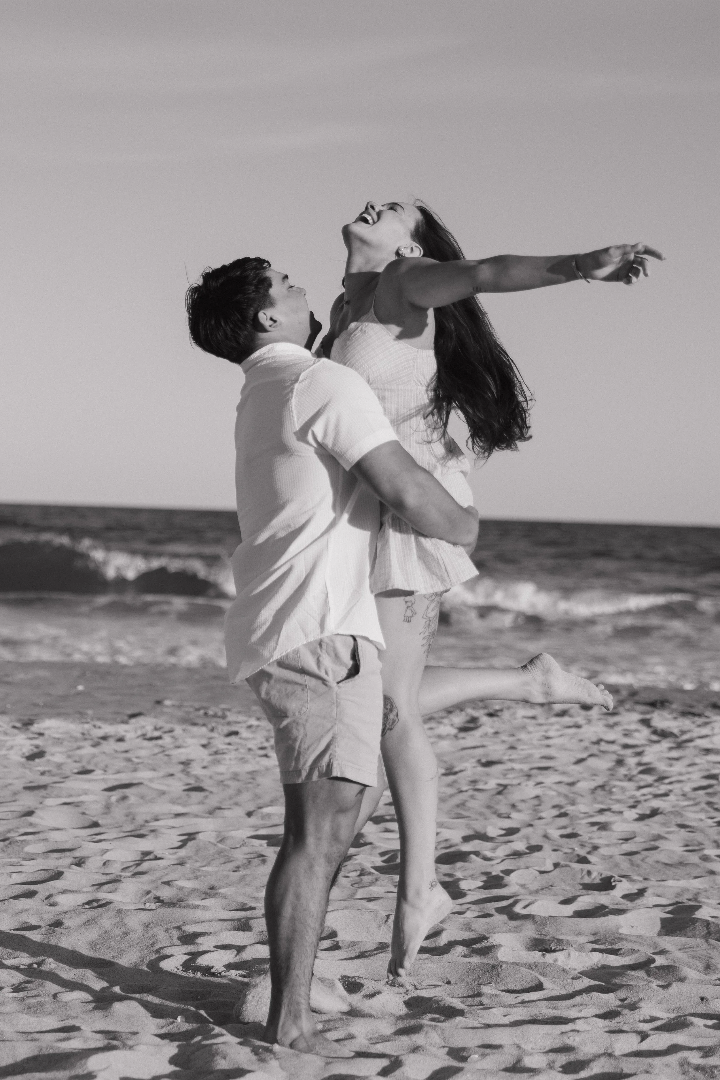 Surf City NC beach photographer, black and white couple portrait with ocean backdrop