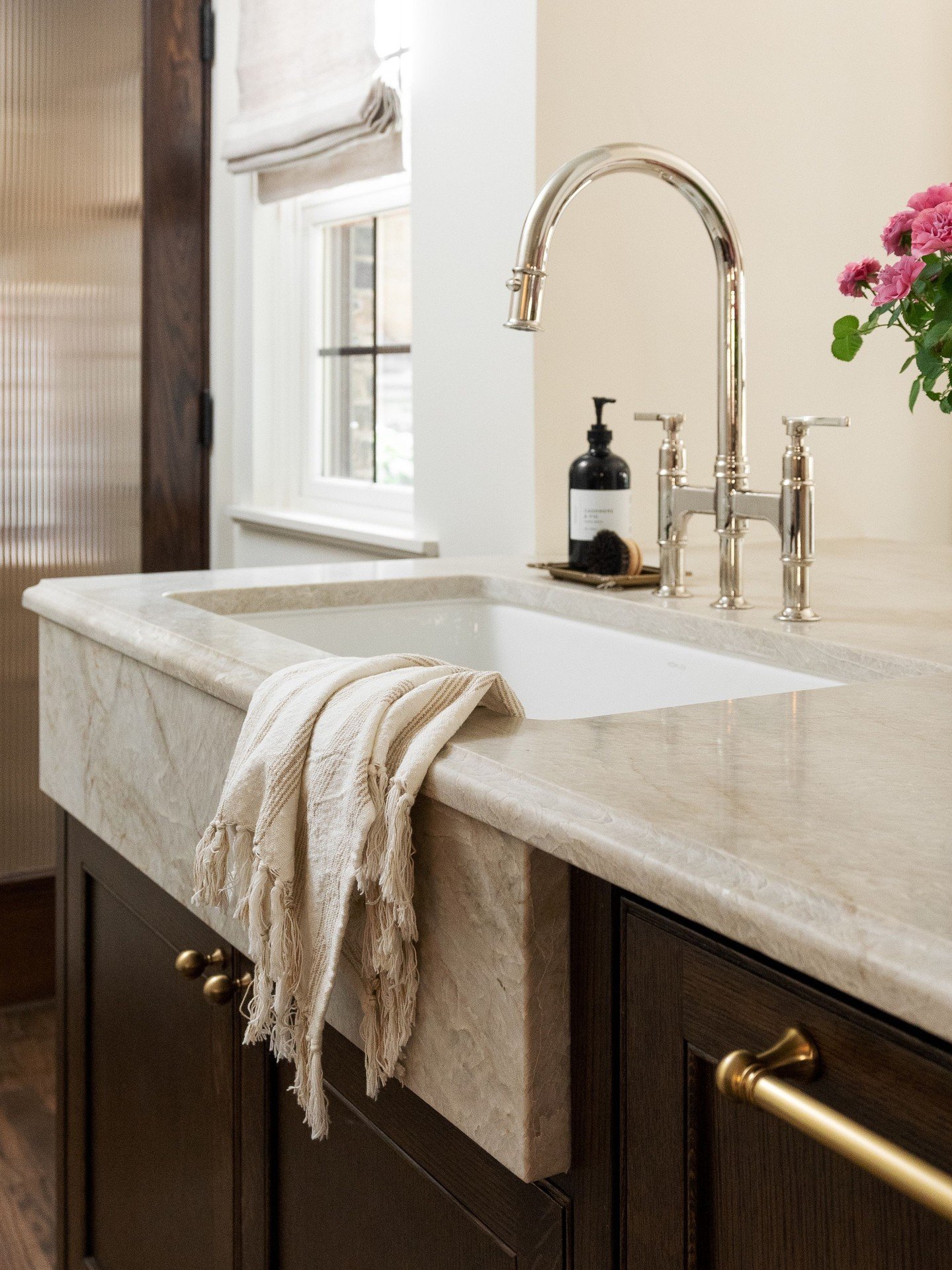 Naturally.⁠
⁠
⁠
⁠Quartzite countertops with an ogee edge, paired with an apron sink, bring a  timeless feel to this hardworking kitchen. The kind of details that feel right at home in this 1920's Tudor.