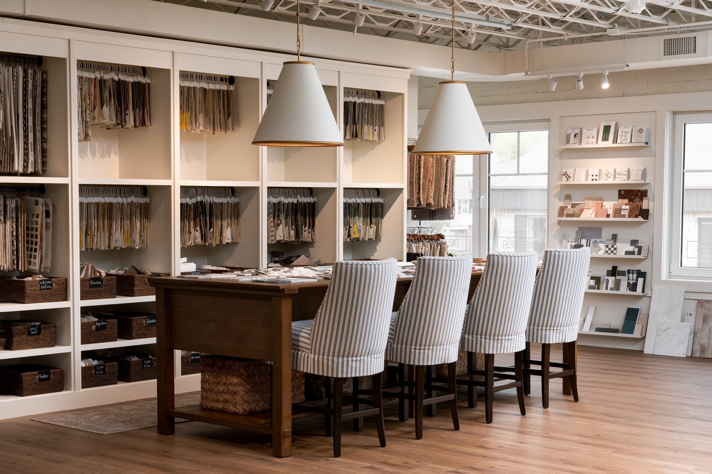 Designing our own showroom and office. ⁠
⁠
For the sample library, we wanted everything organized, but also visible and within reach.  A large table with drawer storage was a necessity, and our team uses it daily to compare different wallpaper, uphol
