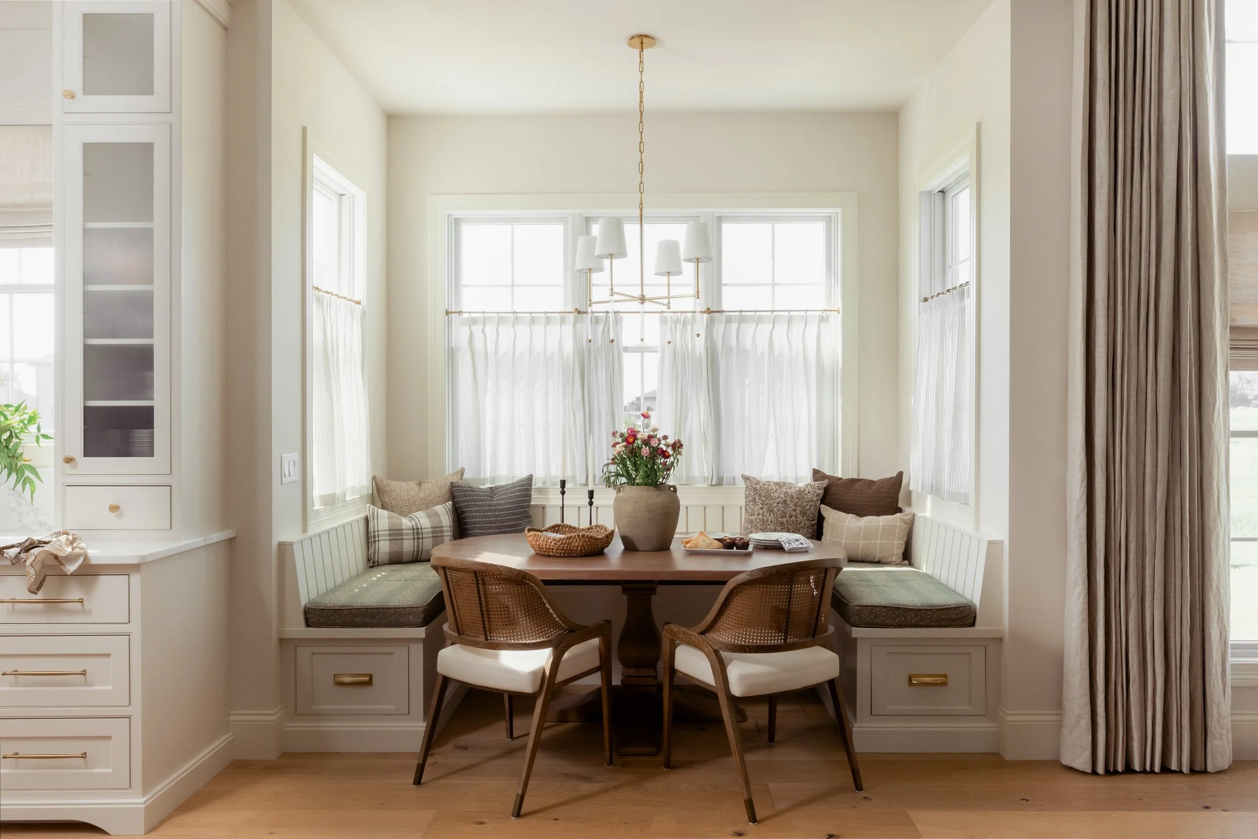 We&rsquo;ll take our coffee here.

A closer look at the breakfast nook and kitchen at Westbridge Estate, where the dining area meets the hardworking side of the kitchen. The built-in banquette, dedicated prep sink, custom cabinetry that looks like fu