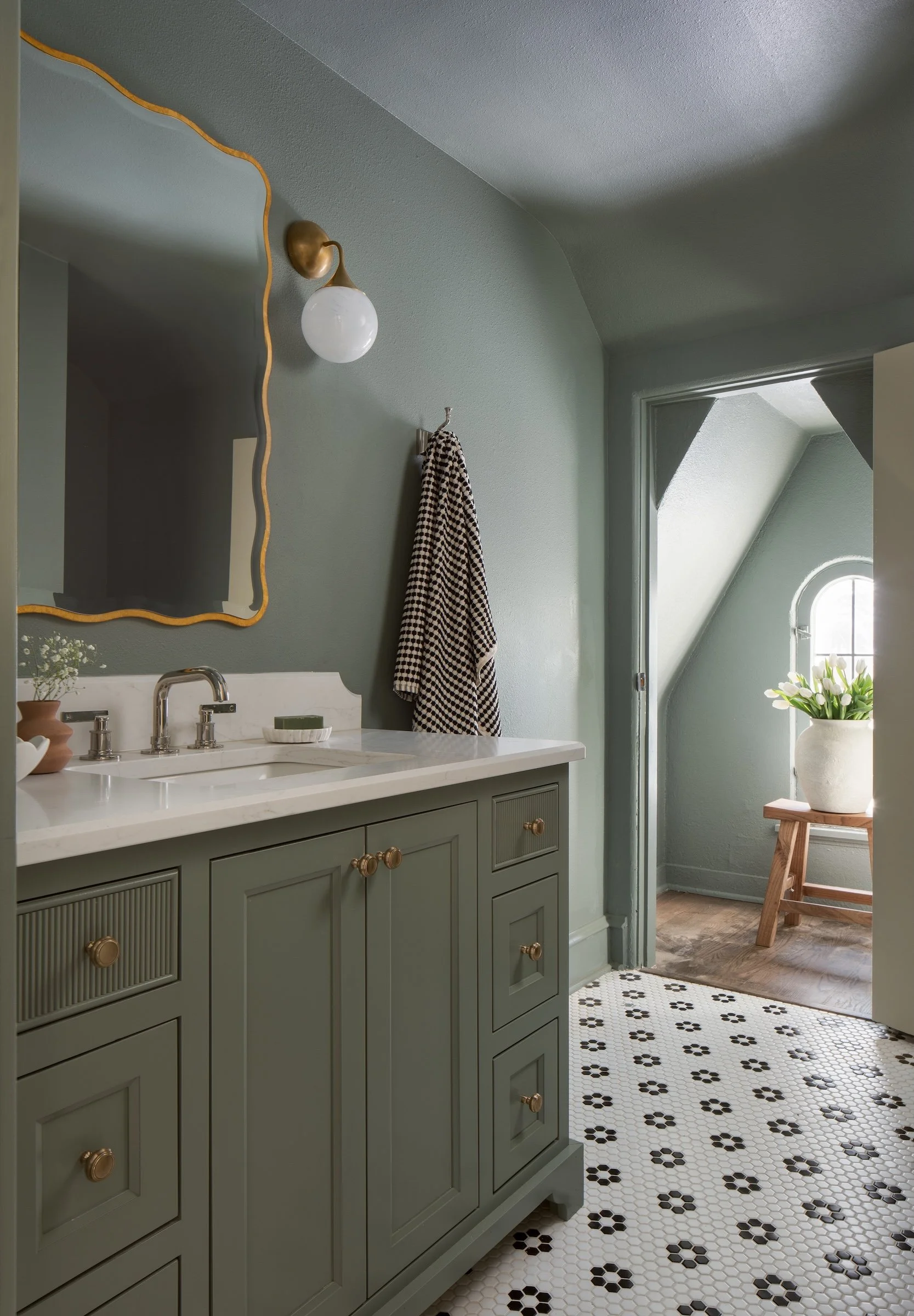 Whitefish Bay Tudor color-drenched green bathroom with mosaic tile flooring