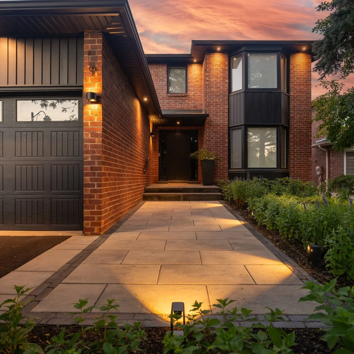 Most people plan a backyard for the daytime. Then the sun goes down and half of it disappears.

Lighting was part of this design from day one, not something added once the stone was already down. When it&rsquo;s planned early, the fixtures sit exactl