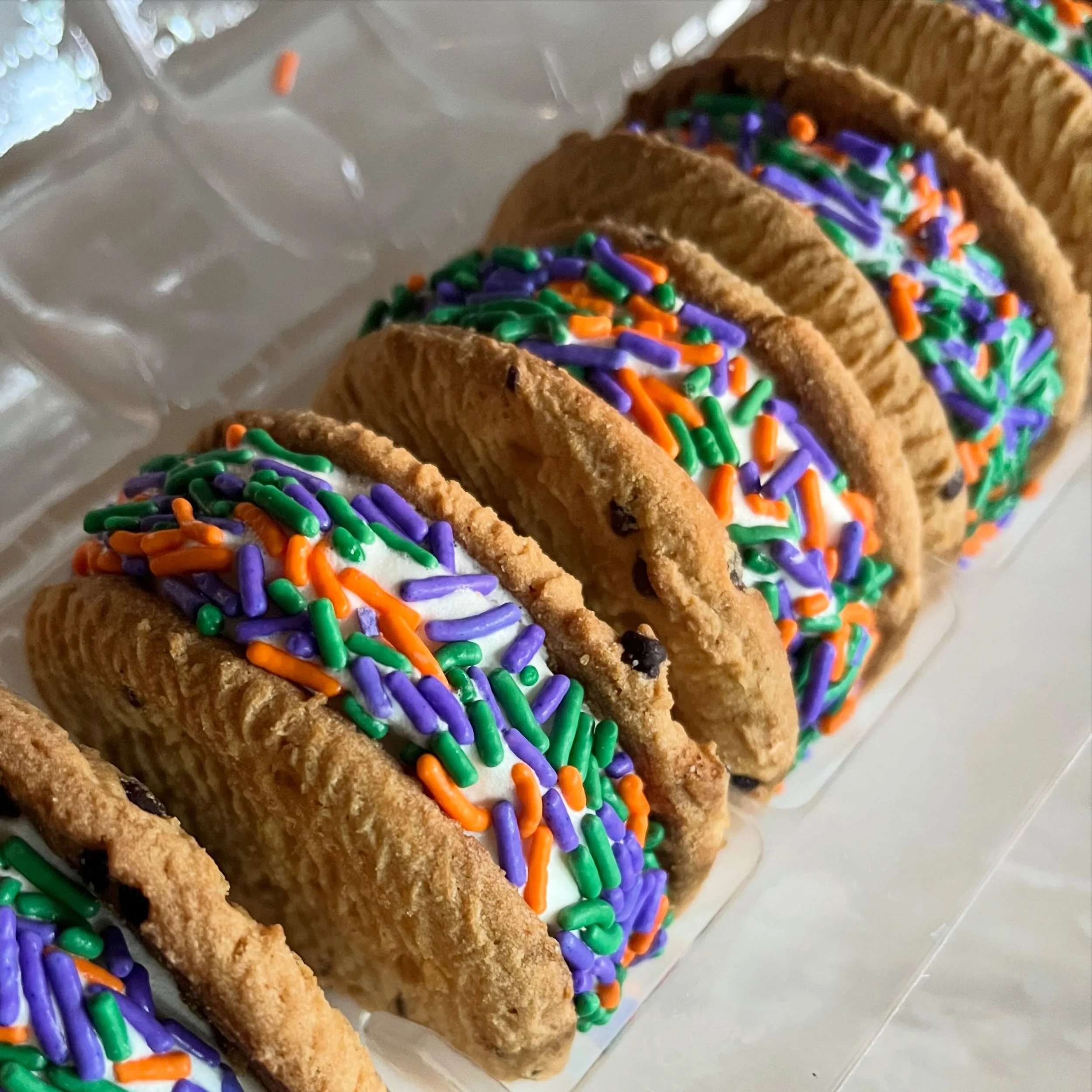 Vanilla ice cream sandwiched between chocolate chip cookies, rolled in Halloween sprinkles. 🍪💜💚🧡🍪
⠀⠀⠀⠀⠀⠀⠀⠀⠀⠀⠀⠀⠀⠀⠀⠀⠀⠀
Sweet, spooky, and WAY too good to share. 
⠀⠀⠀⠀⠀⠀⠀⠀⠀⠀⠀⠀⠀⠀⠀⠀⠀⠀ 
Come on by!
 🍁Sunday-Thursday: Noon-9pm
 🍁Friday-Saturday: Noon