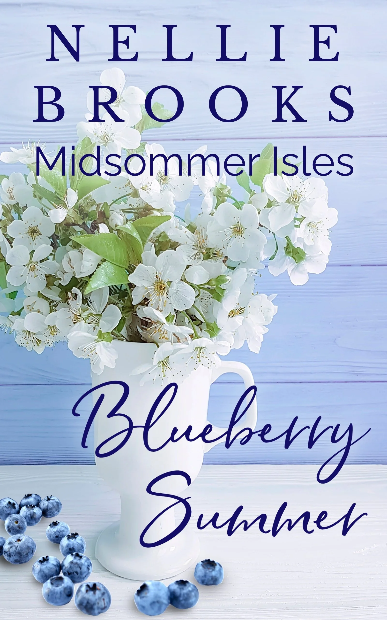 A vase of blossoms and blueberries on a table