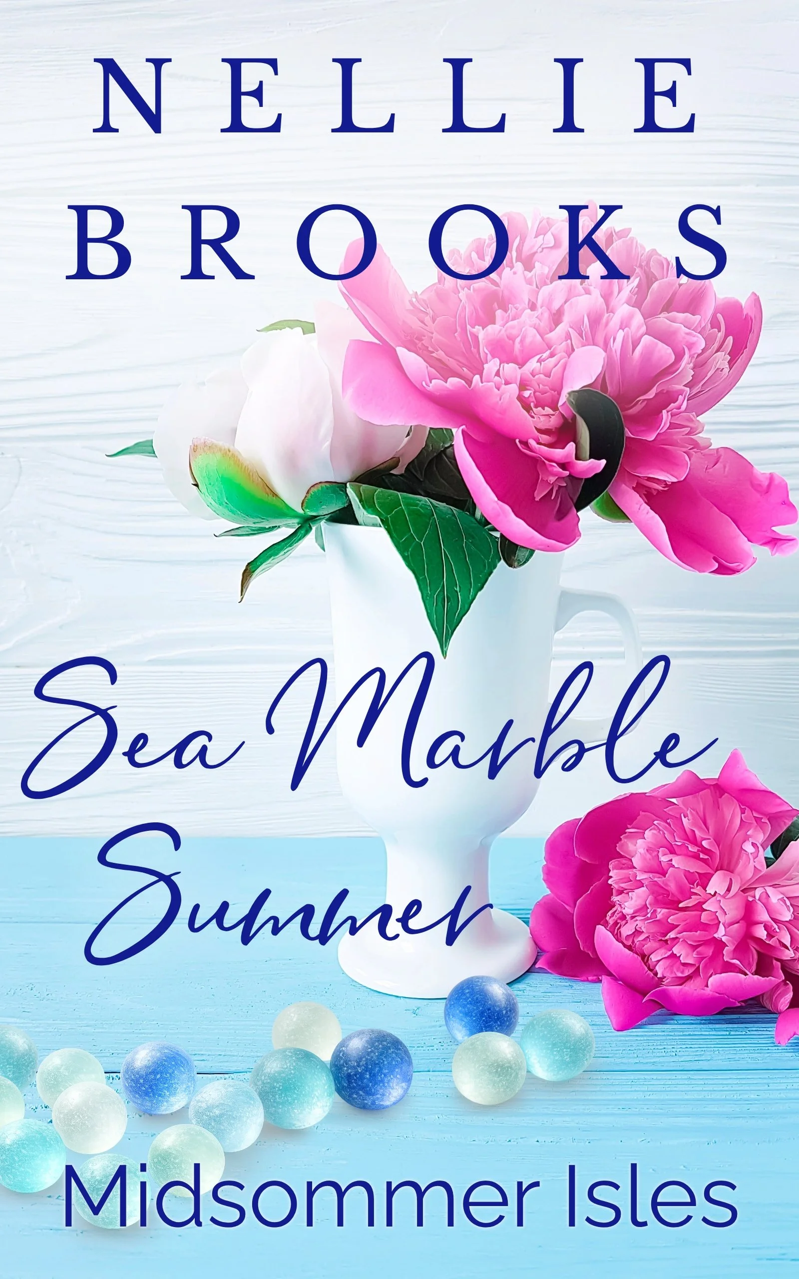 A vase with pink peonies and sea marbles on a table