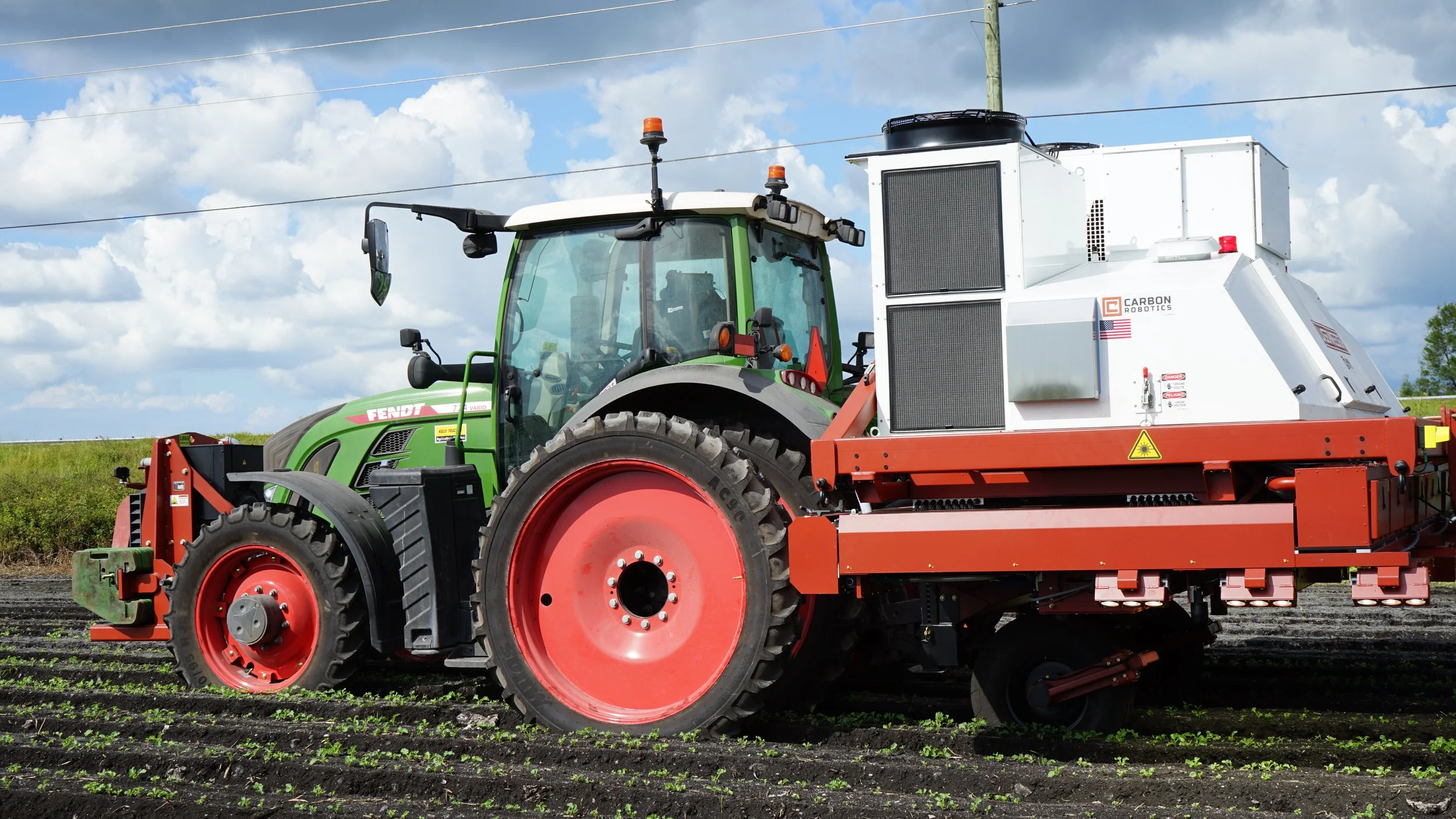 Tractor with automated weeding attachment in a field