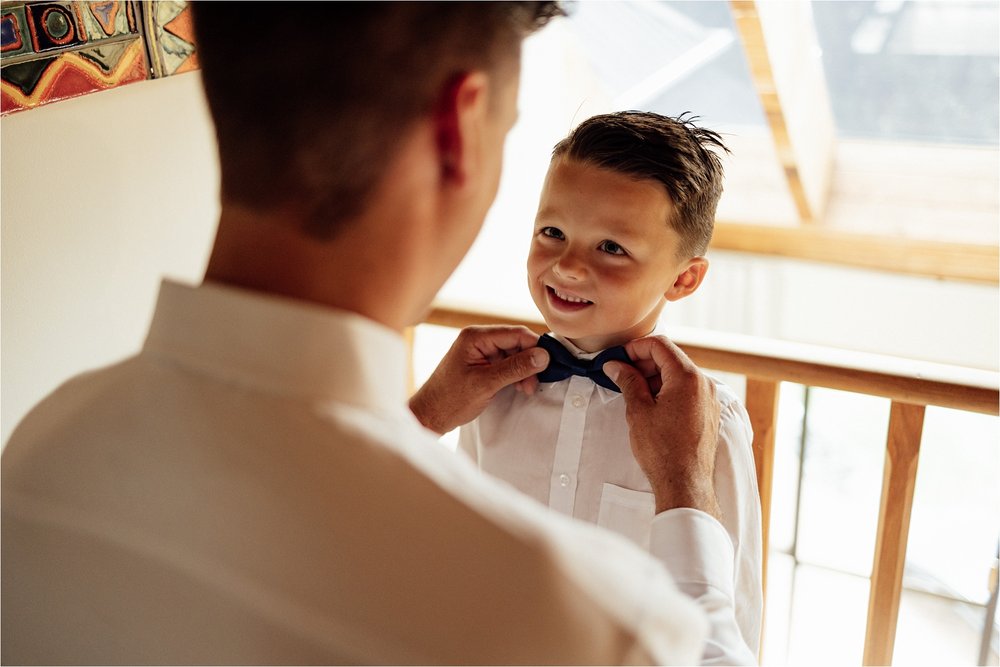  dad tying sons bow-tie 