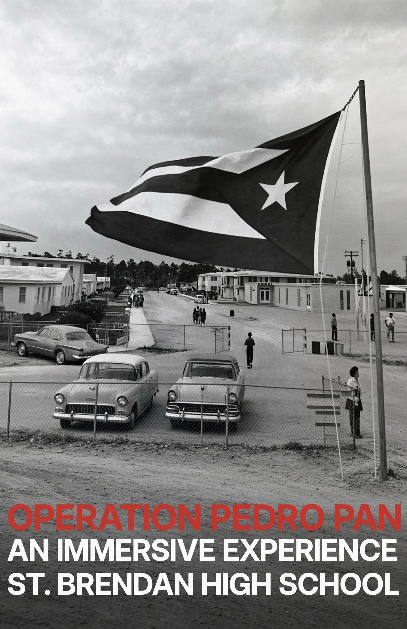 Black and white photo of a school with a large Puerto Rican flag waving in the foreground. The sky is overcast, and there are several cars parked and people walking near the school building. The text overlay reads "Operation Pedro Pan: An Immersive E