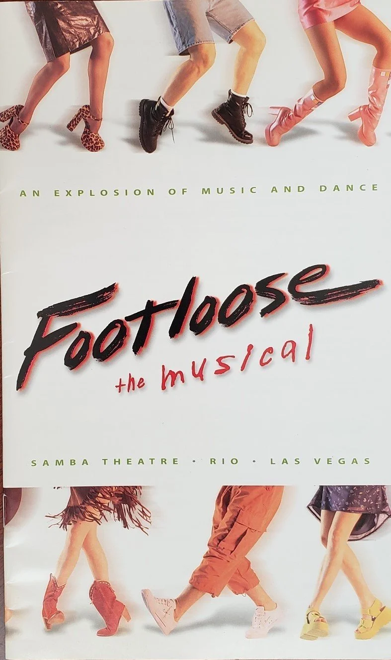 Promotional poster for the musical 'Footloose,' featuring images of people’s legs in dance poses wearing colorful shoes and boots, with the subtitle "AN EXPLOSION OF MUSIC AND DANCE" and the location details "SAMBA THEATRE · RIO · LAS VEGAS".