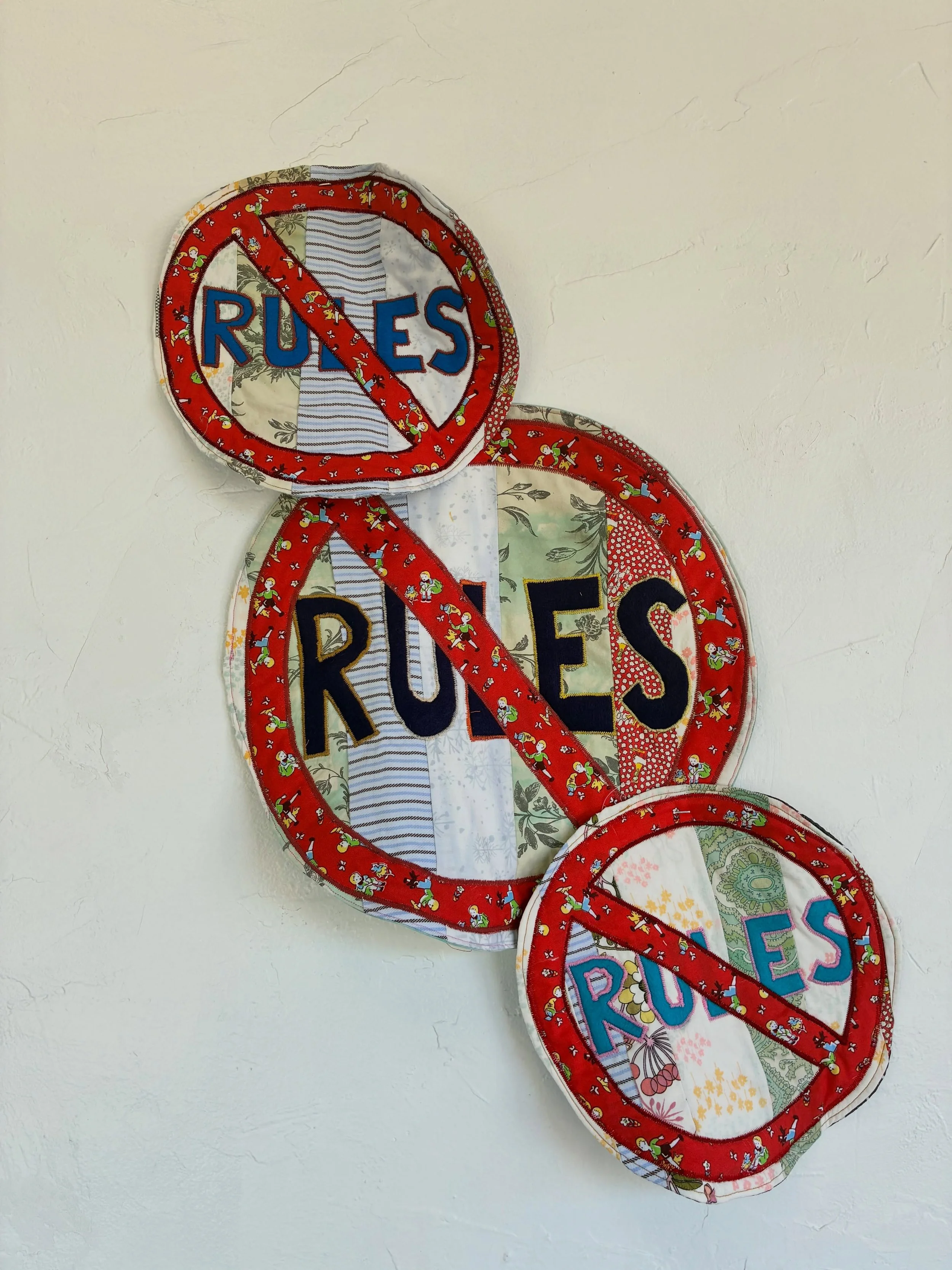 &ldquo;No Rules&rdquo; by Steve deBruyn 

Bespoke Quilts 
Small Rules - $100
Large Rule - $200

Gentle Reminders at The Savage Mystic Gallery - May 2026