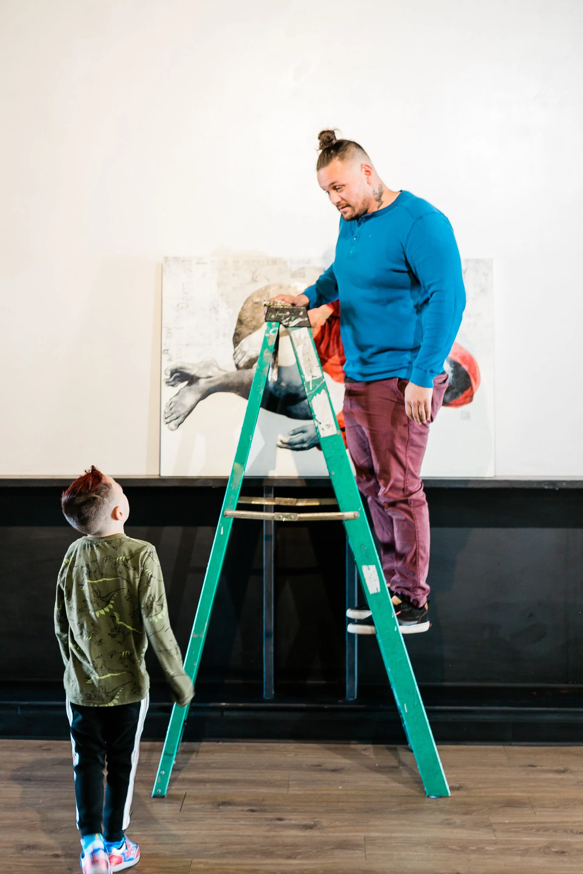 Curator Pan Pantoja with his son, Axiom.  