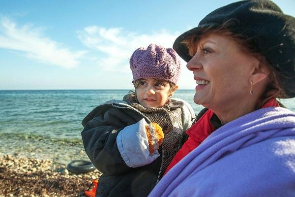 Source: Tyson Sadler | RYOT News Susan Sarandon holding a baby at a refuge camp in Greece.