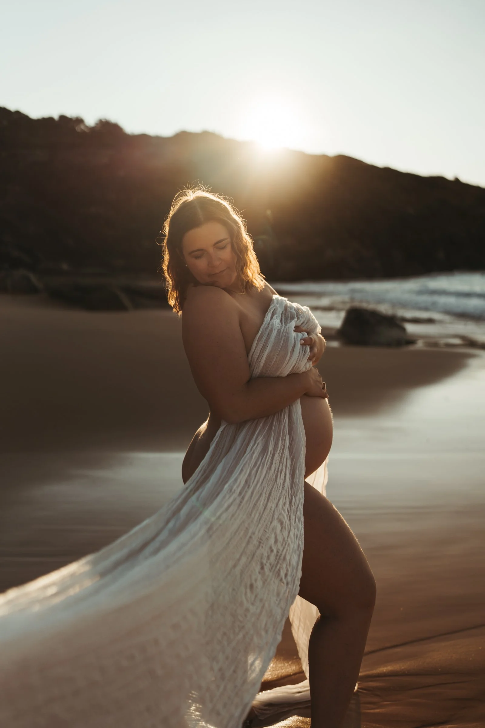 Pregnant woman at a relaxed maternity photography session on the beach in Sydney