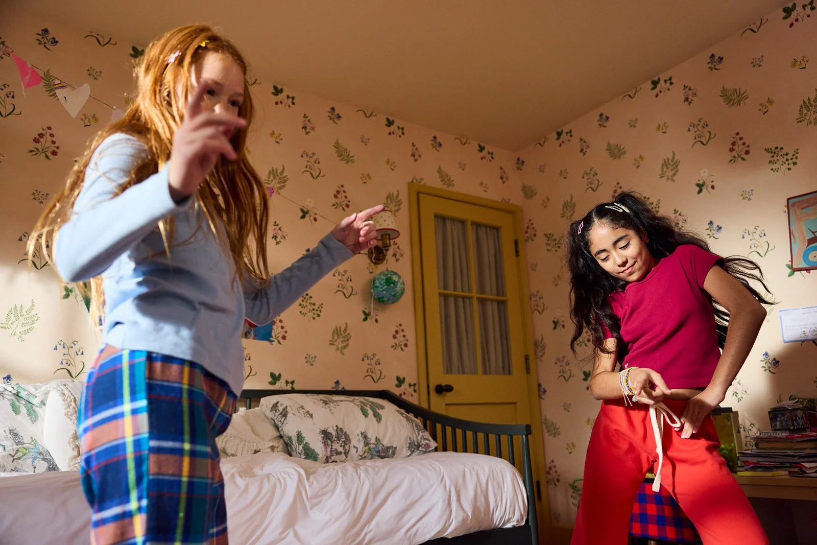 Pre Teens dancing in bedroom