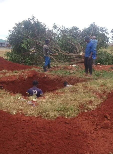 Digging the hole for a septic tank for the toilets in the classroom block at Kaloko.