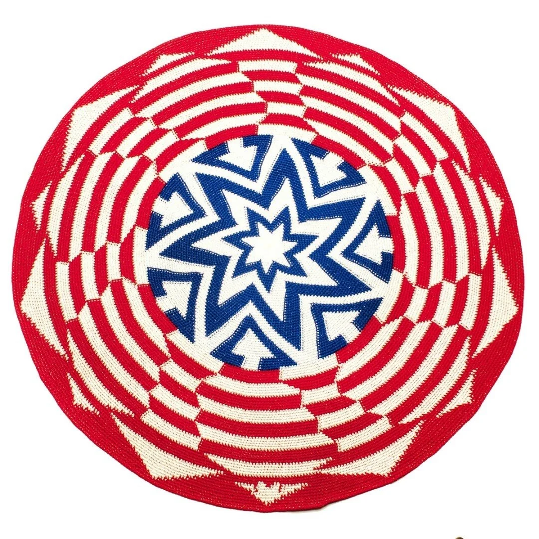 Marlisa Anderson,&nbsp;America Stars &amp; Stripes (What Goes Around Comes Around).&nbsp;Crocheted mandala using multiple threads and a single crochet stitch to create a tight- woven closed tapestry. 32”-36” Diam.