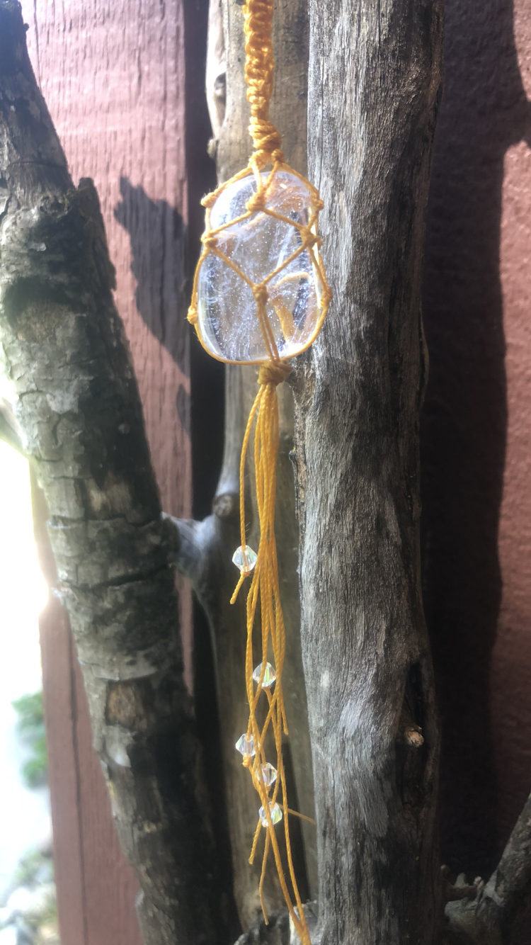 Clear Quartz Wrapped In Yellow Macrame Adorned With Reflective Crystals