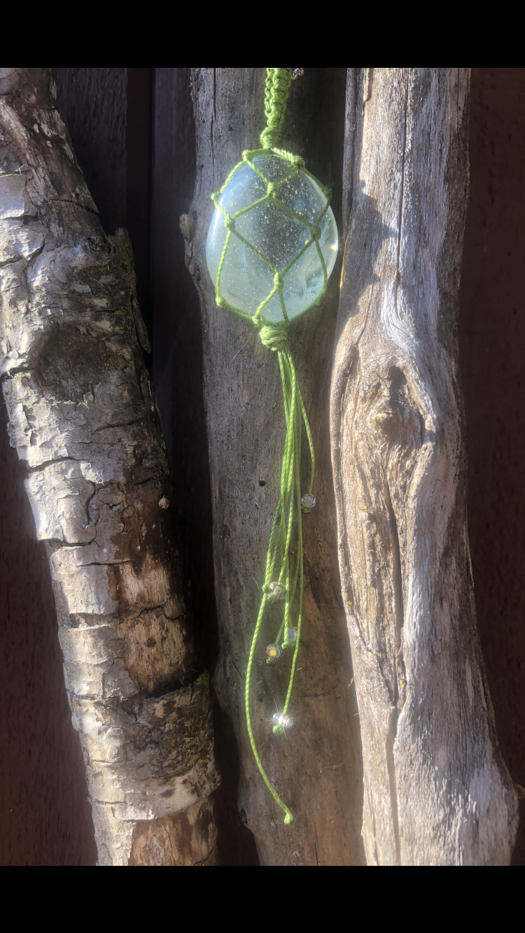 Moonstone Wrapped In Light Green Adorned With Reflective Crystals