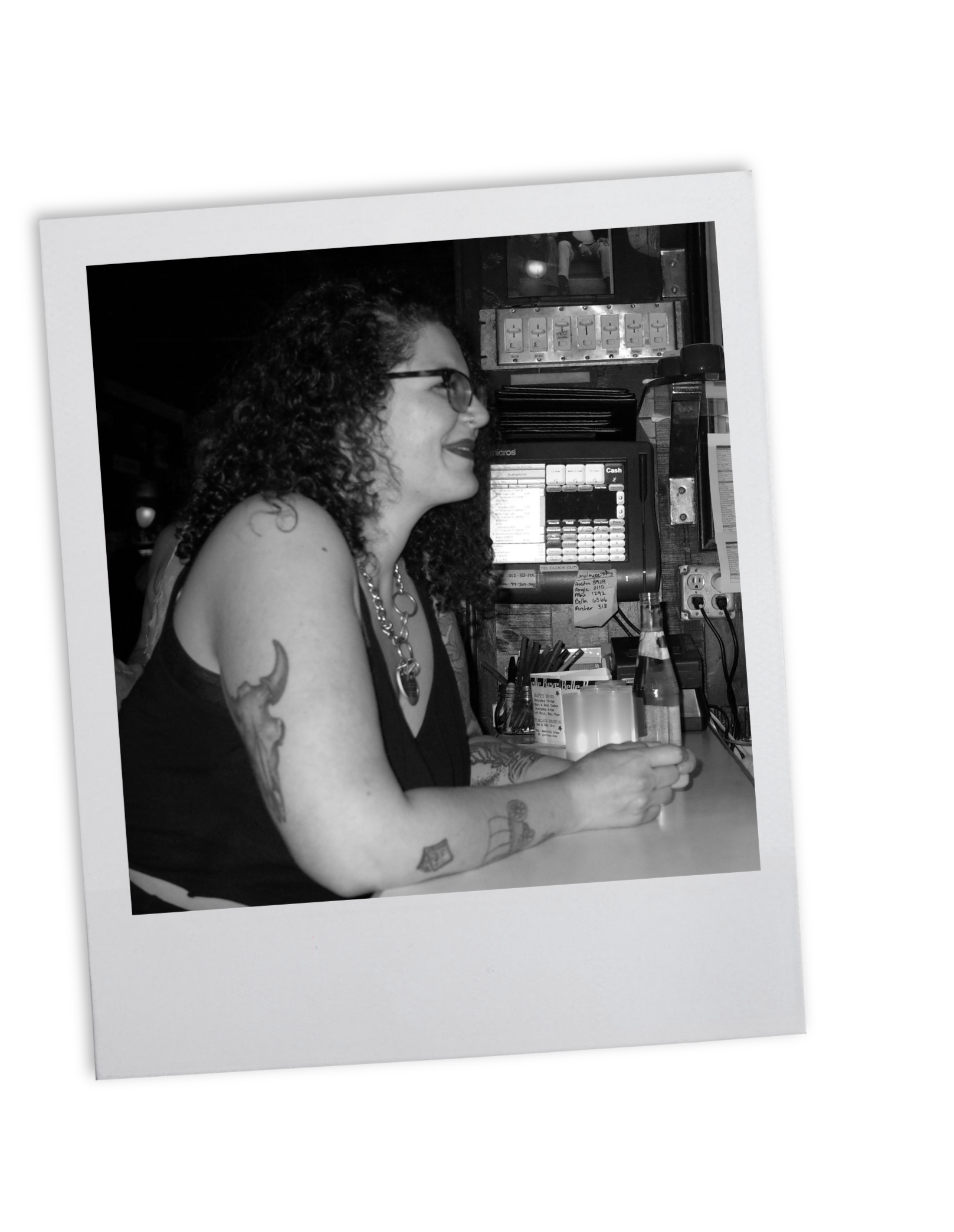 poloroid photo of Meryl leaning over a bar while serving a bottle of beer