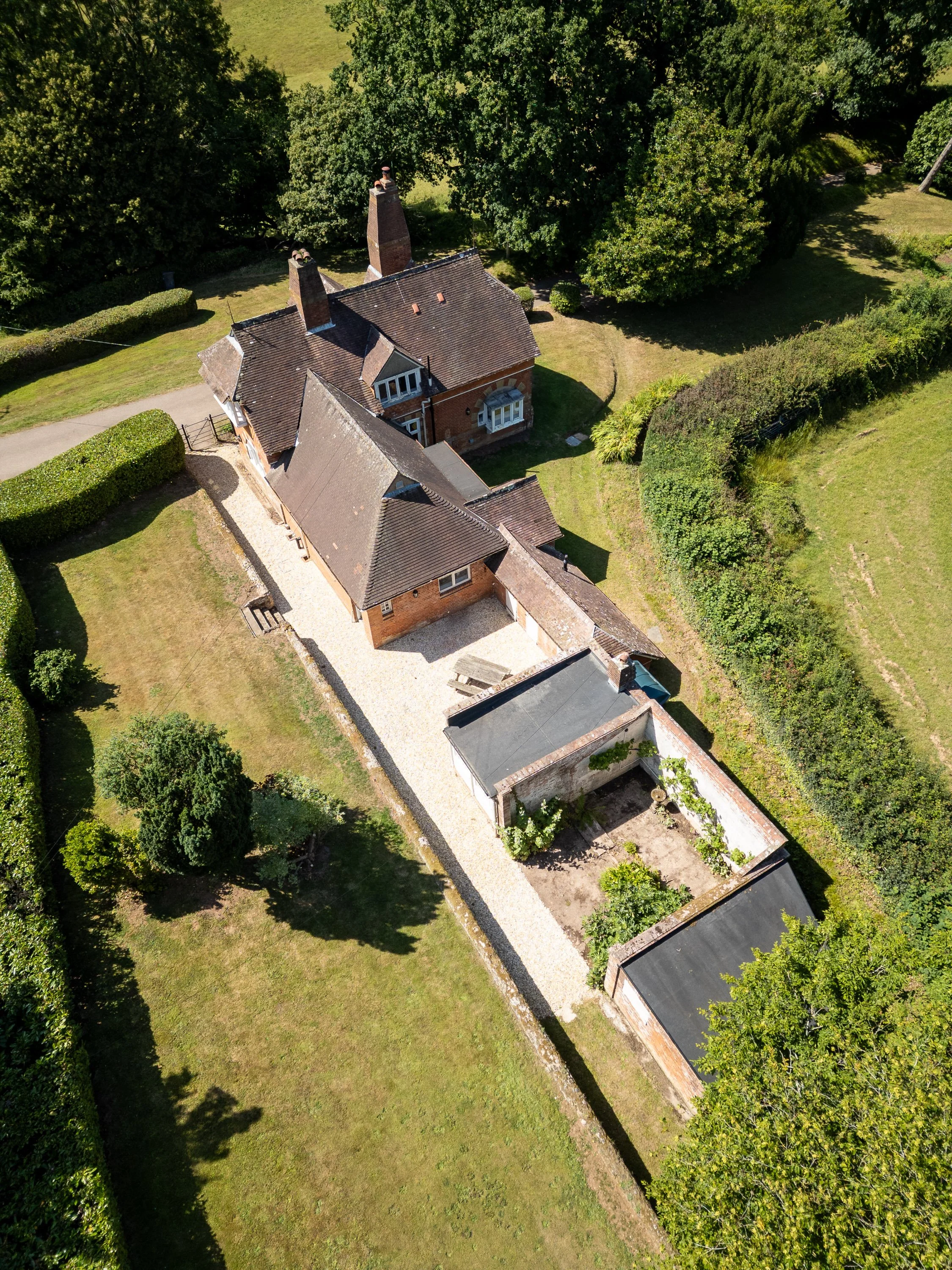 Drone photography of Mouseplatt in Sidbury, showing country house, garden, and outbuildings