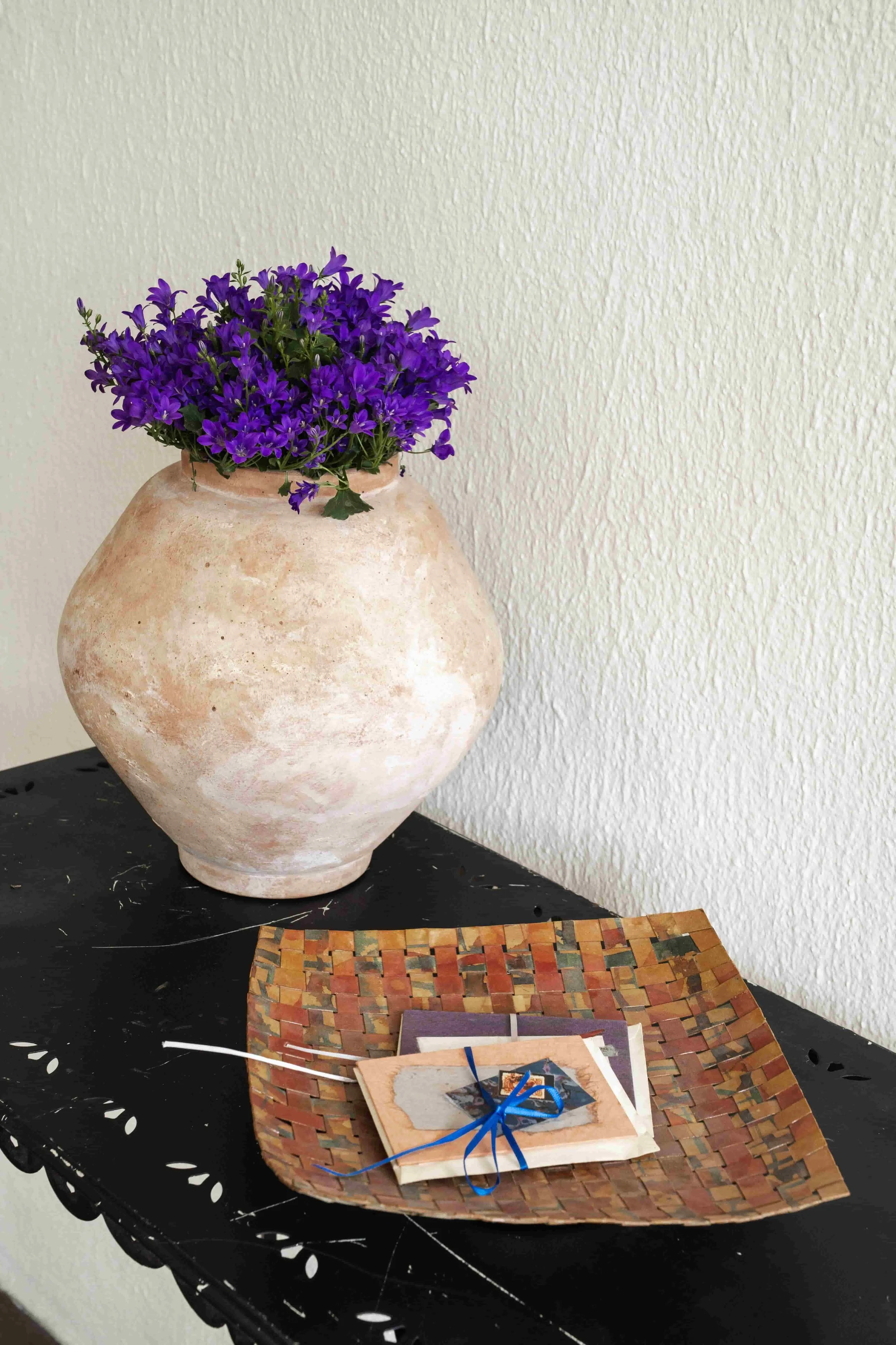 wovenpaper bowl on a steel table.jpg