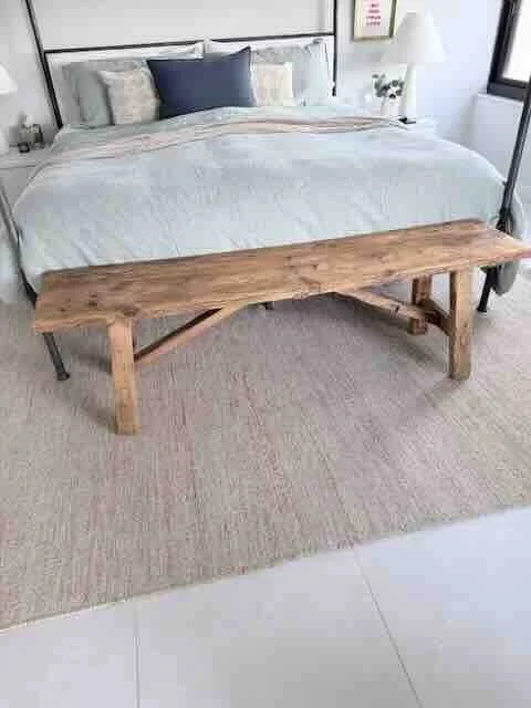 pine bench at the foot of the bed.jpeg