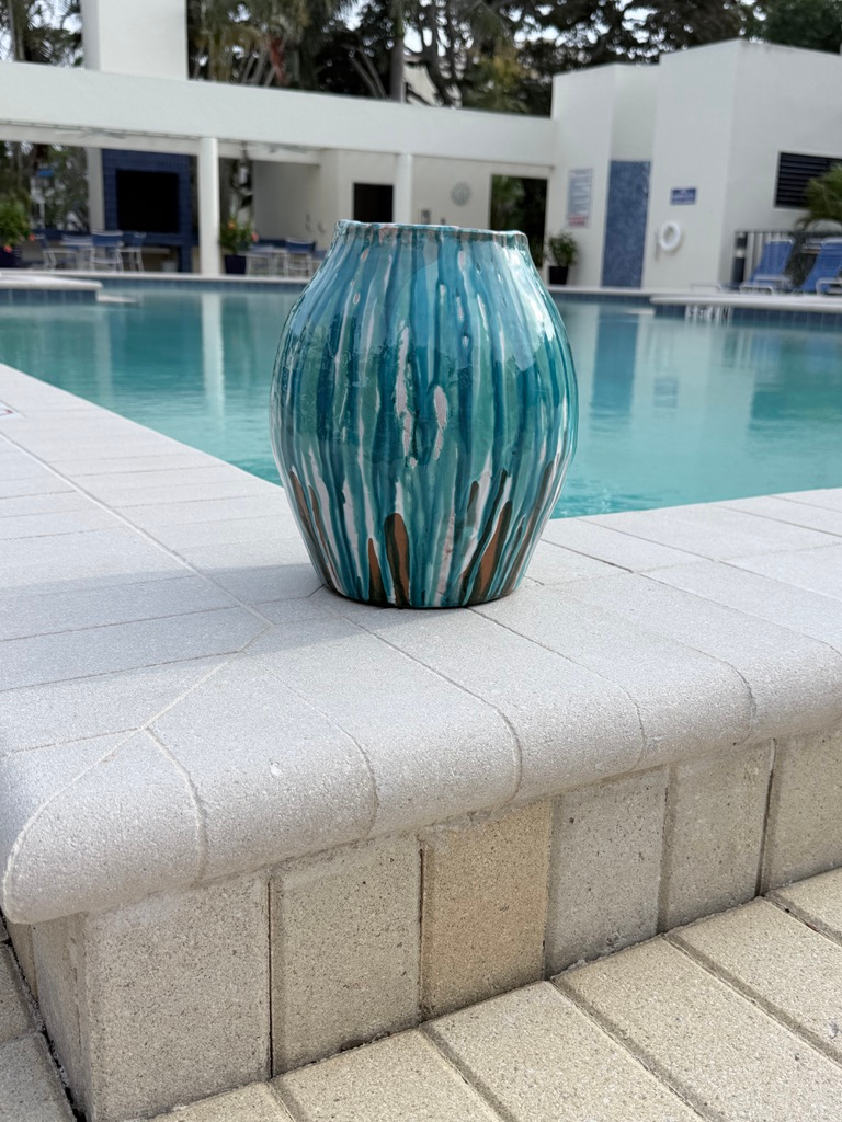 Onofrio Acone ceramic urn. by the pool.png