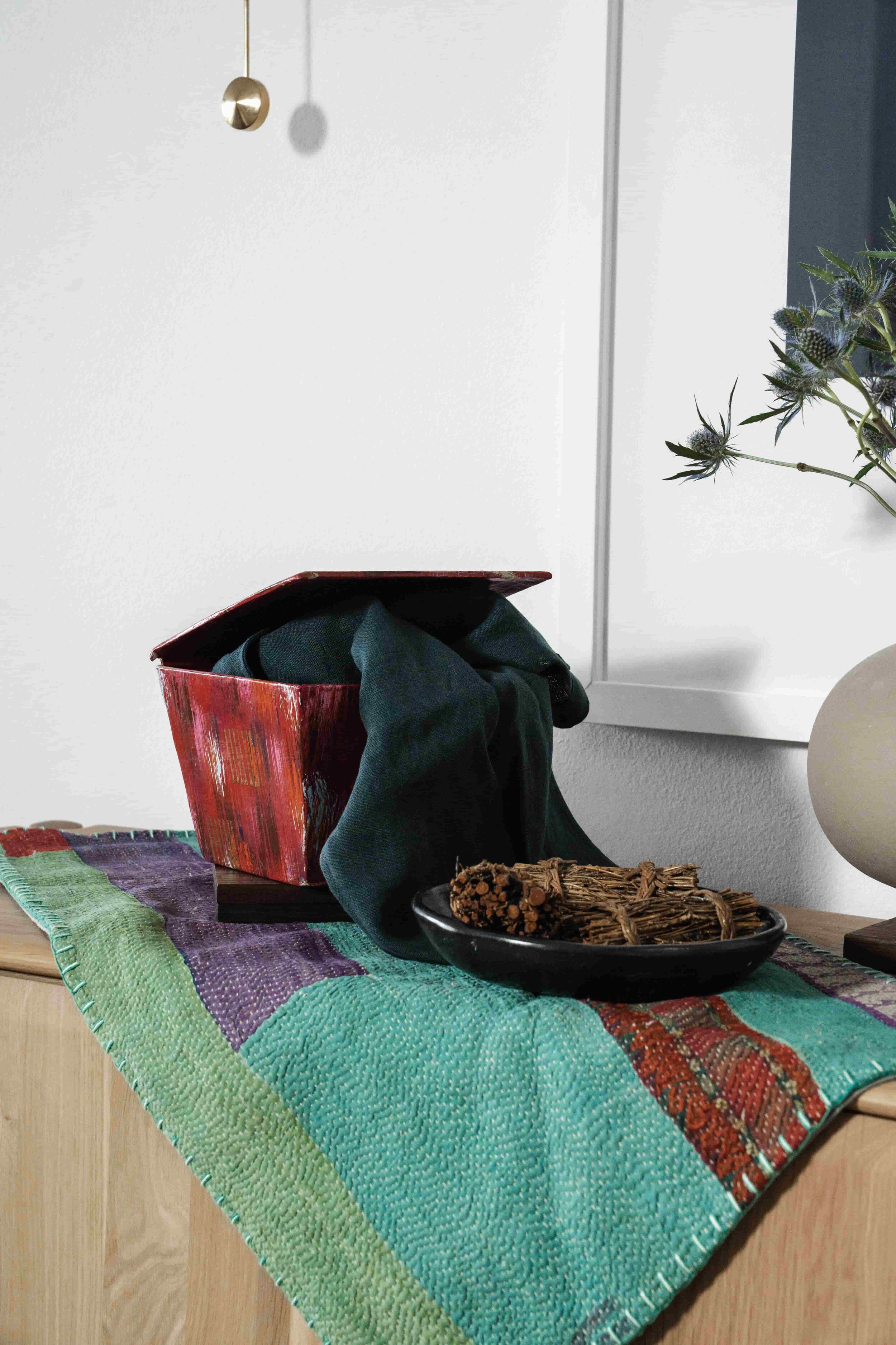 Pink painted bowl on antique scrap of cloth.jpg